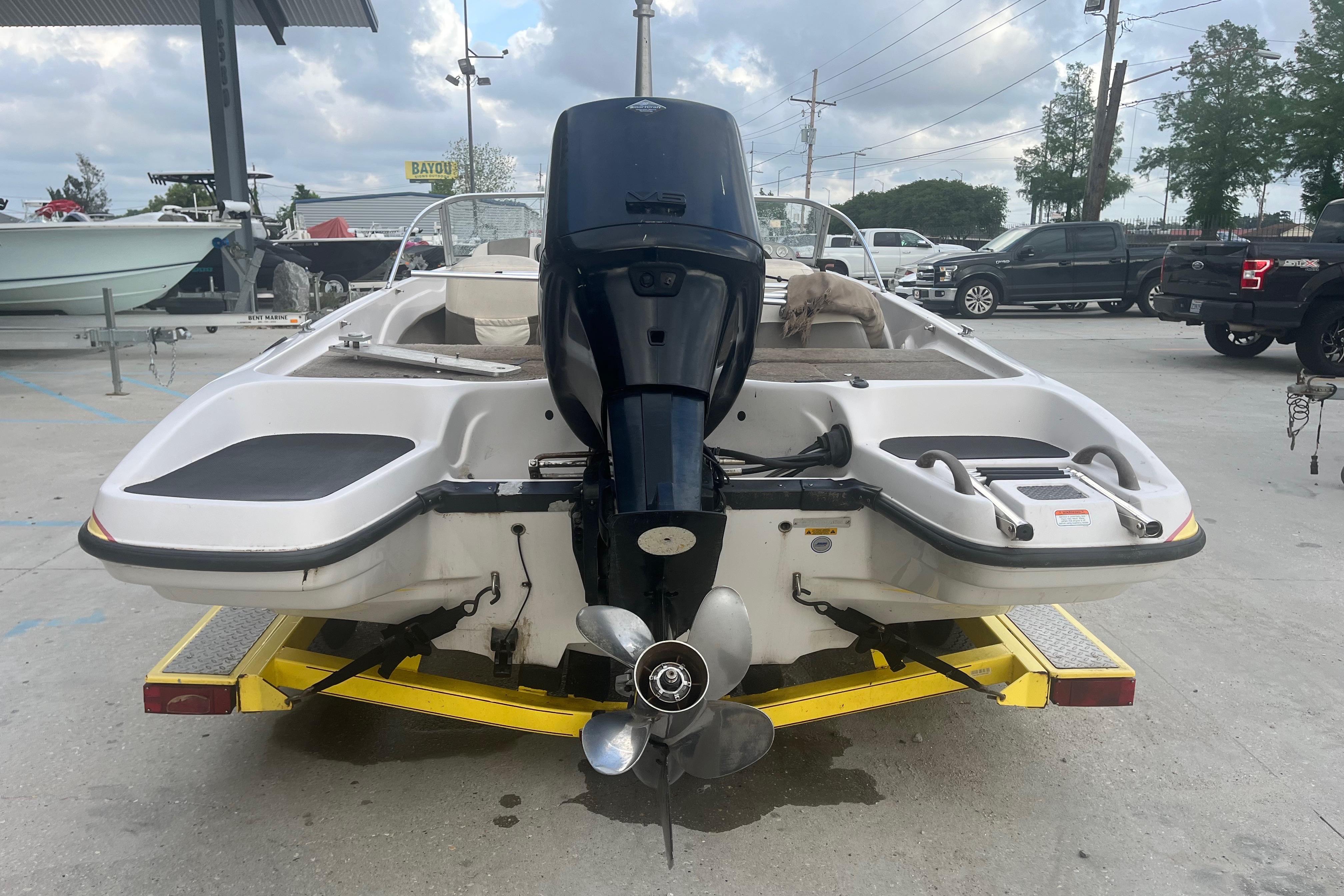 2006 Nitro 189 Sport boat on trailer, rear view with outboard motor.