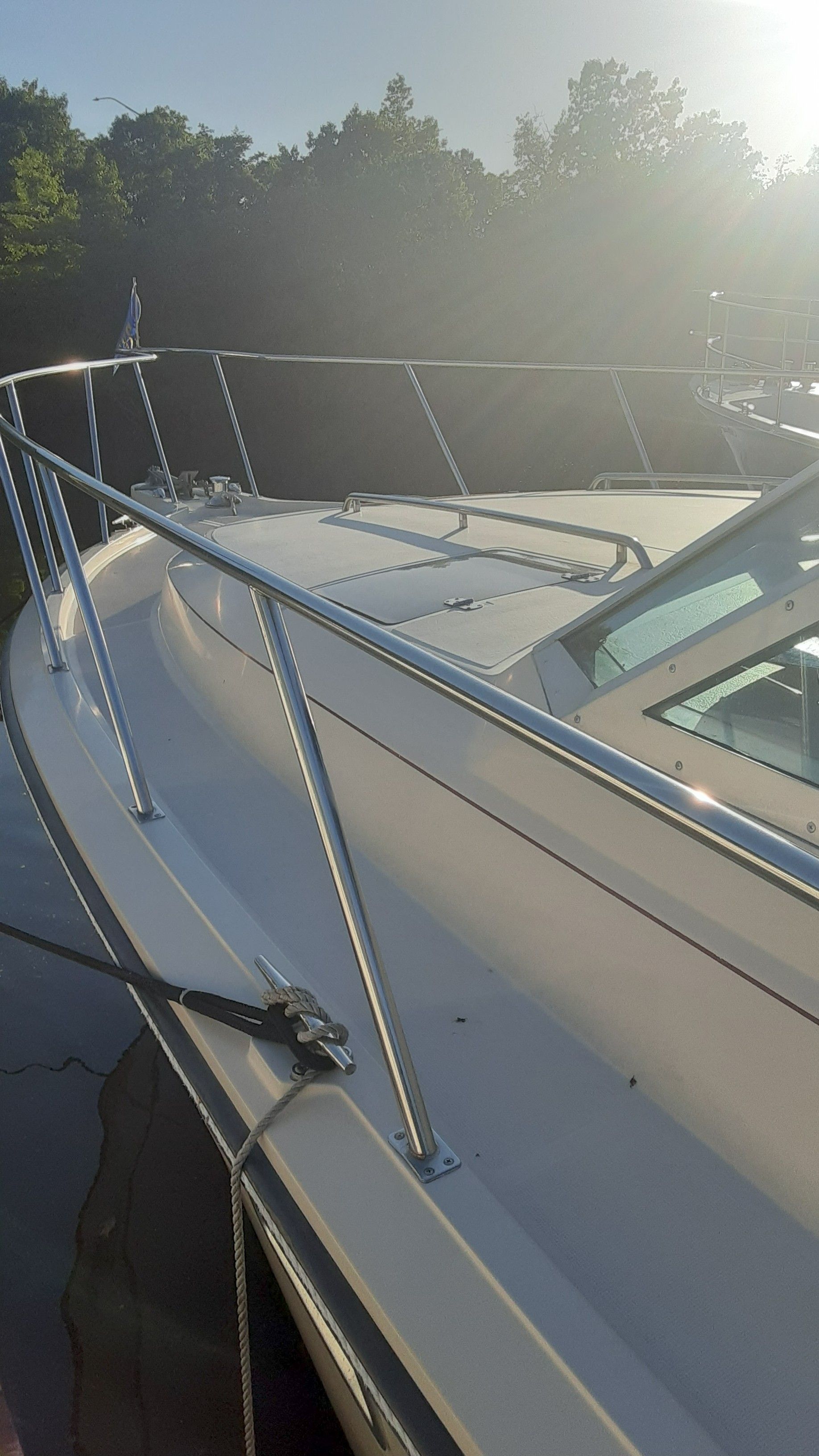 1985 Tiara Yachts 3100 Open on water at sunset.