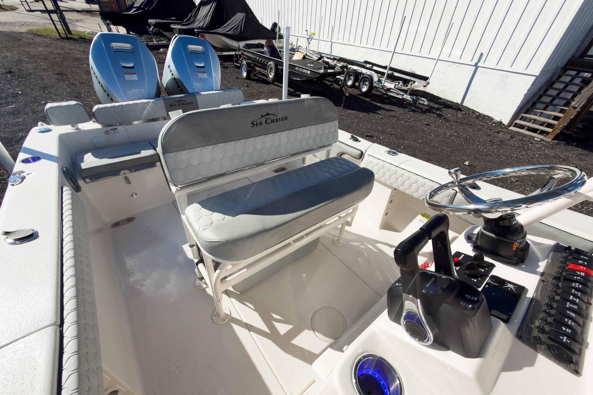 2026 Sea Chaser 24 HFC DE boat interior with helm and seating area.