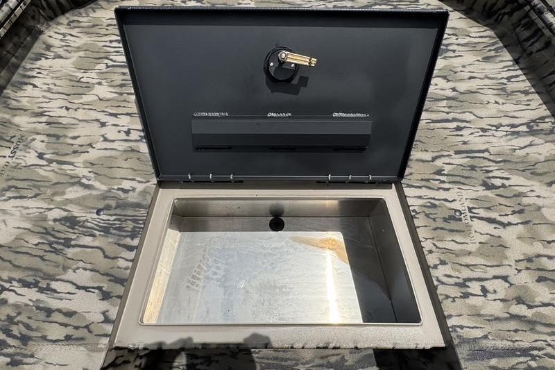 Open storage compartment on 2027 Excel 230 Bay Pro Elite boat.