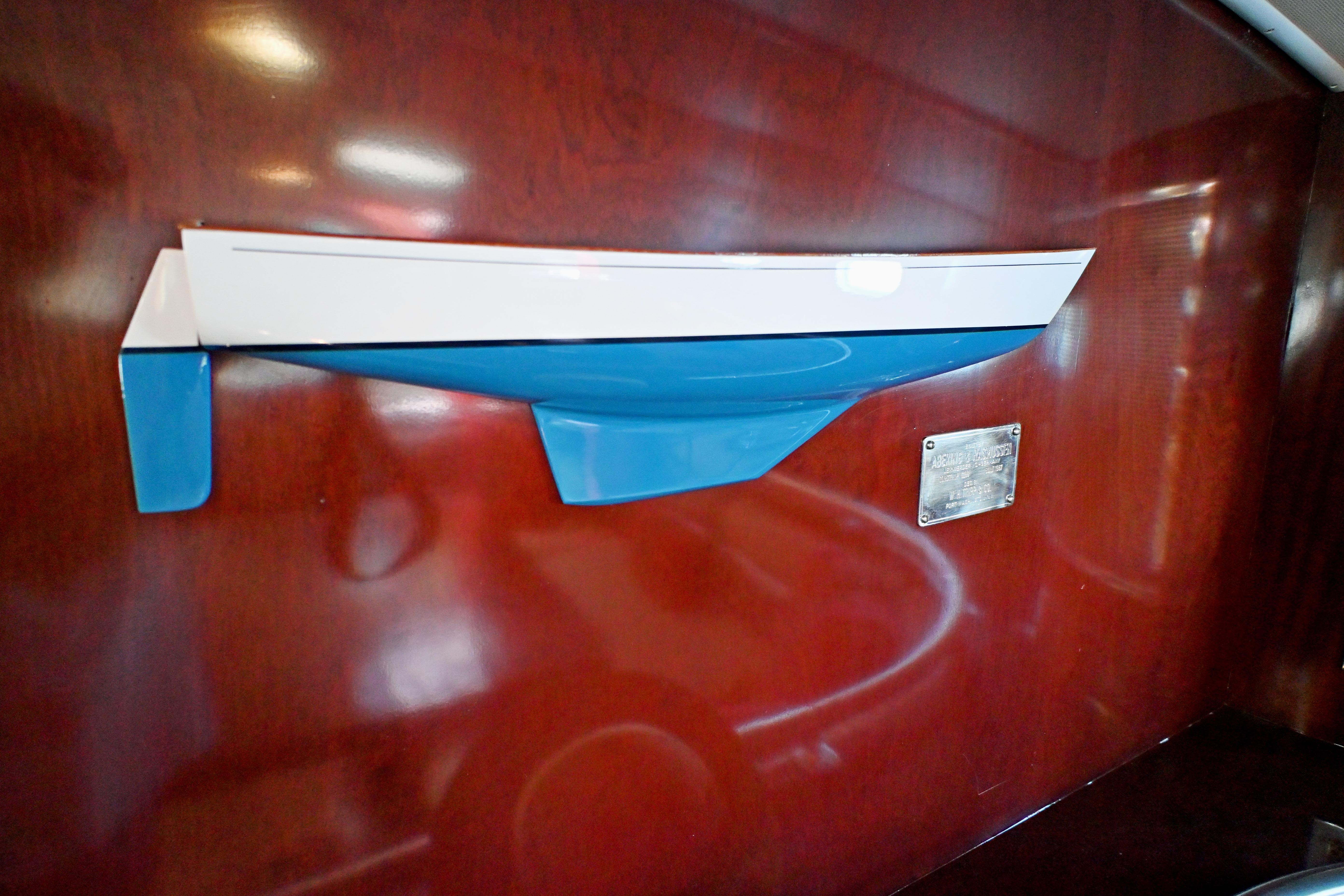Model of Abeking & Rasmussen Tripp 74 yacht, 1968, displayed on wooden wall.