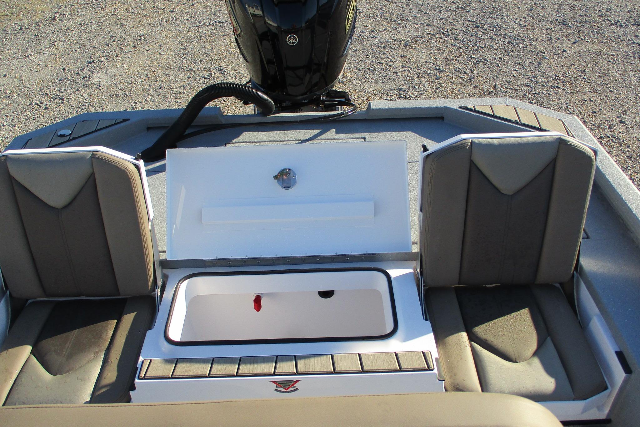 2026 Vexus ACX2210 boat interior with open storage compartment and seating.