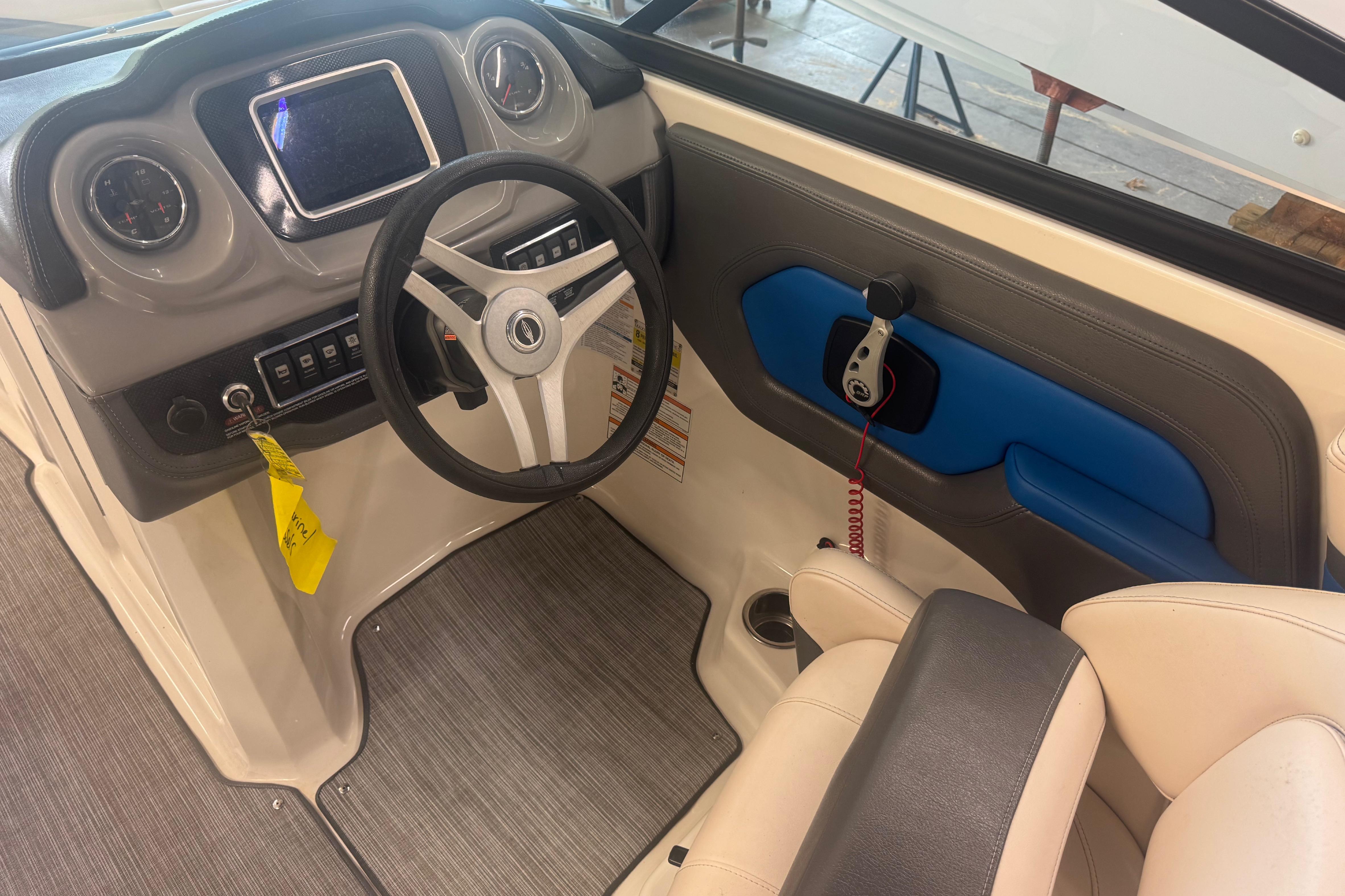 2017 Chaparral Vortex 203 VRX boat interior with steering wheel and dashboard controls.