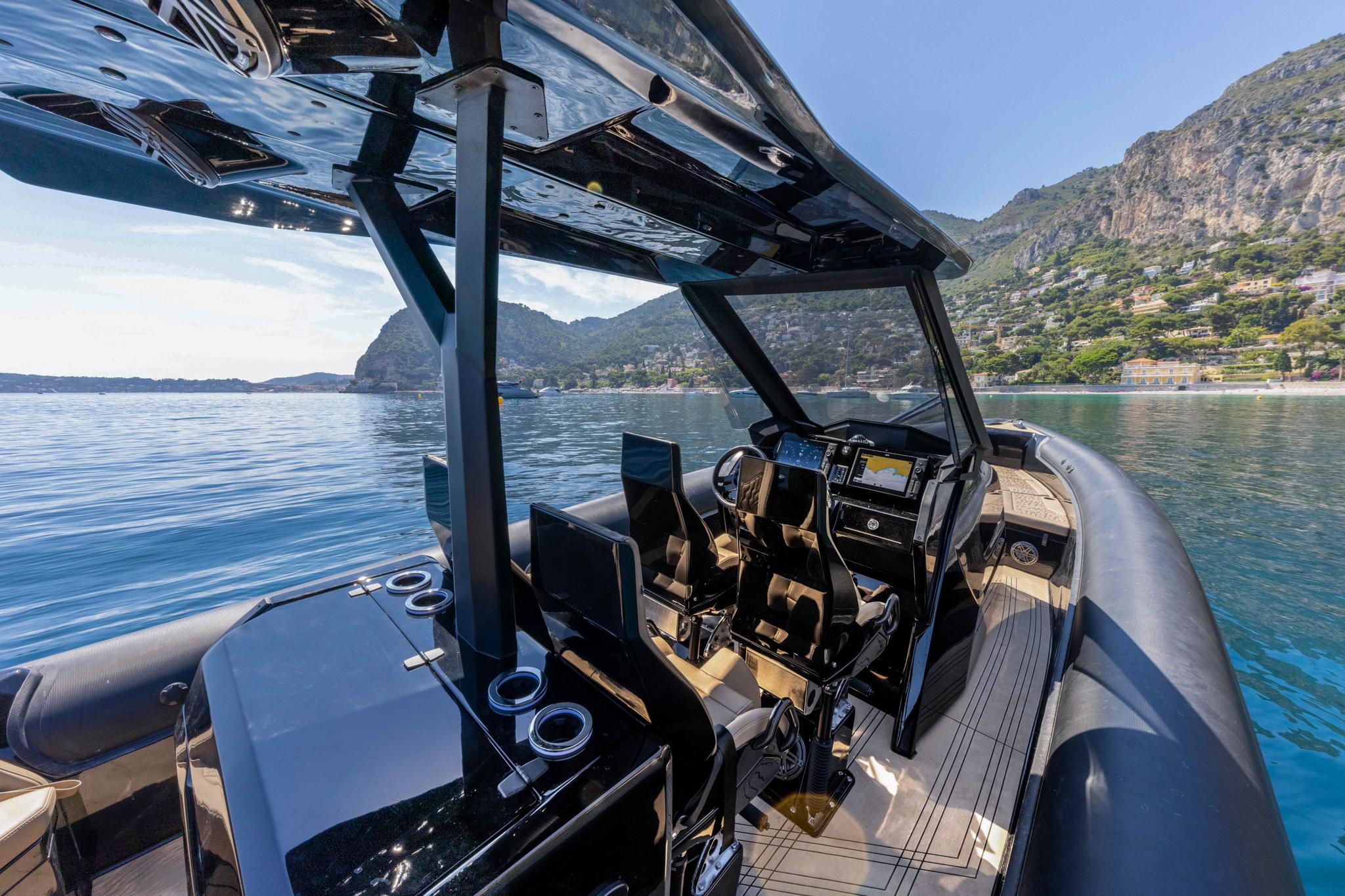 Luxurious 2024 Olympic OLR 40SR boat interior with scenic coastal backdrop.