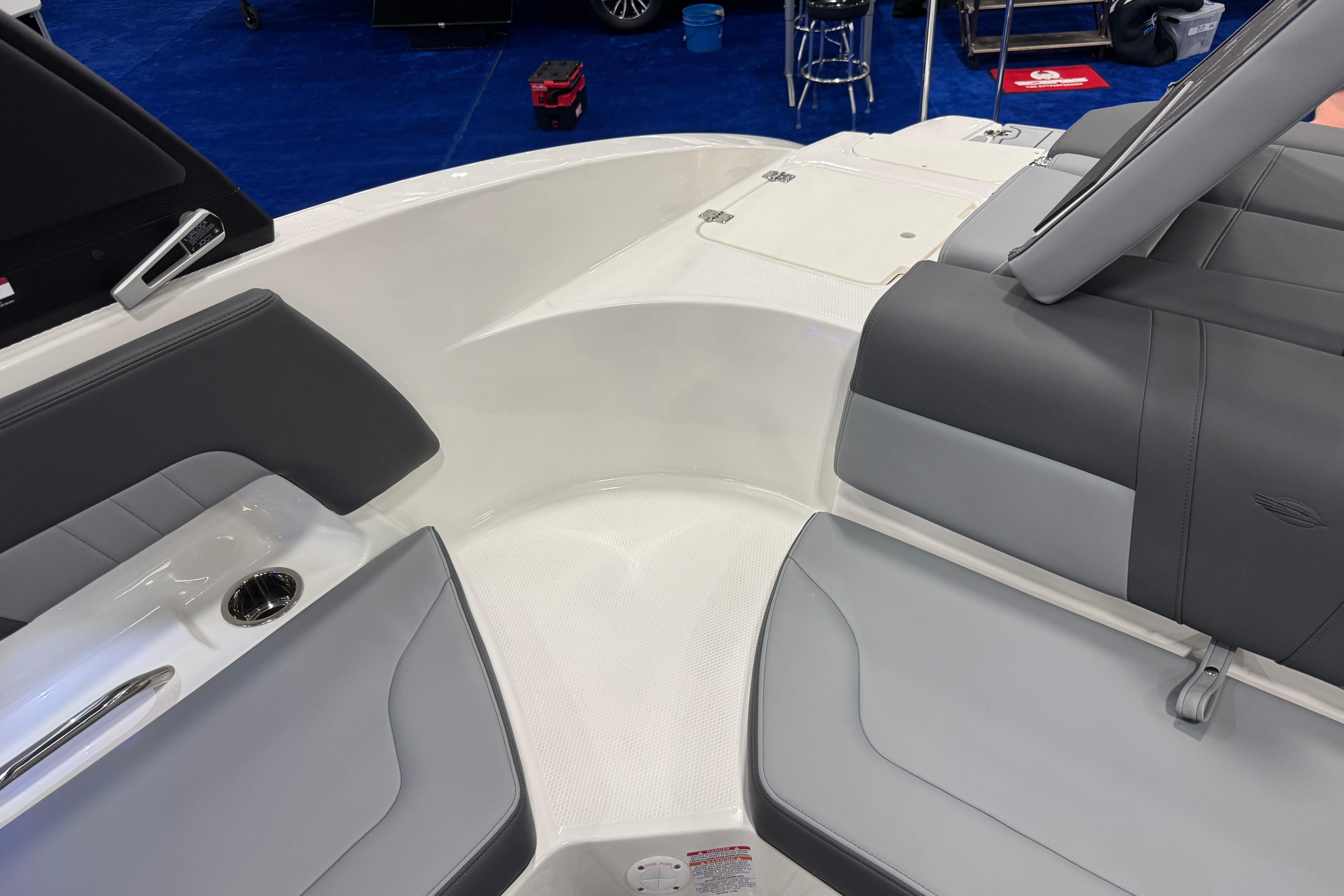 Interior of 2026 Chaparral 23 SSi boat with gray seating and cup holder.