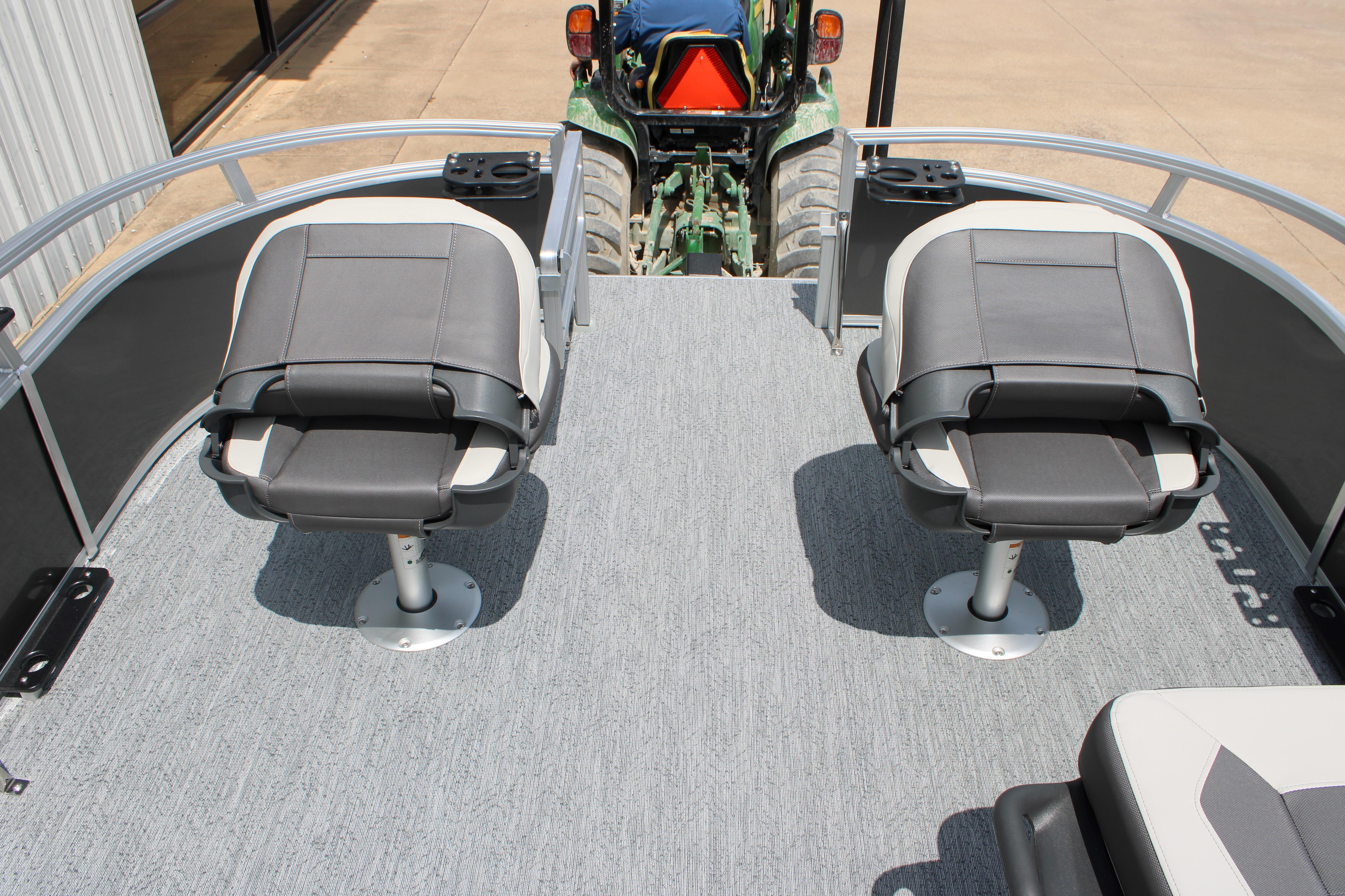 2026 Sun Tracker Bass Buggy 18 DLX pontoon boat with dual swivel seats.