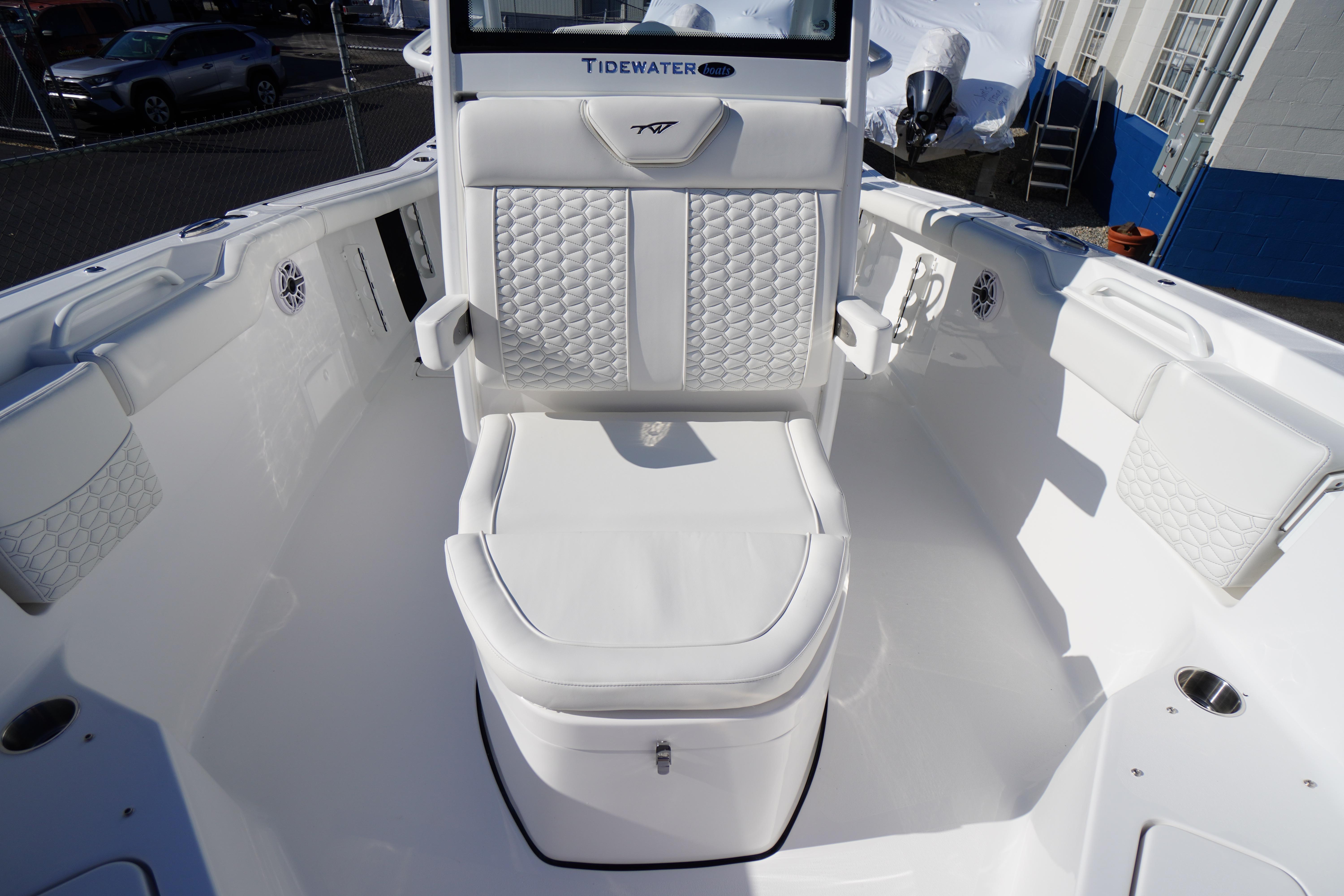 2026 Tidewater 272 LXF boat interior with white cushioned seating and modern design.