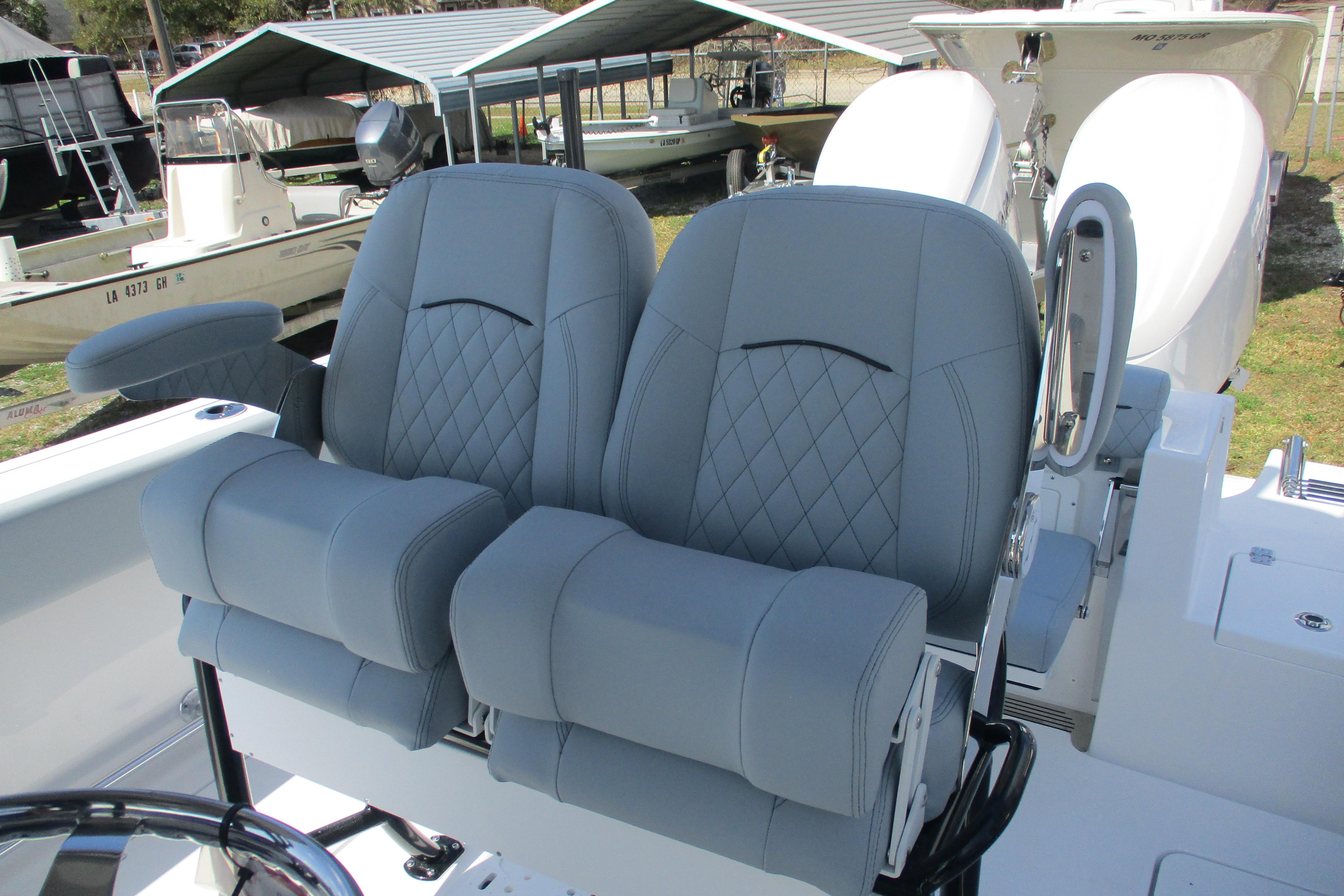 2026 Sportsman Open 252 Center Console boat with dual cushioned seats.