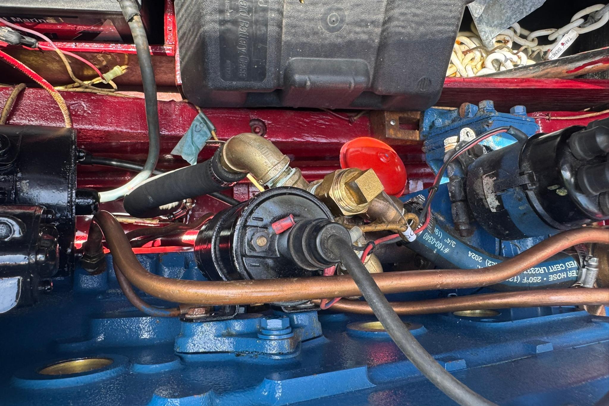 Close-up of a 1952 Chris-Craft 18 Runabout engine components and wiring.