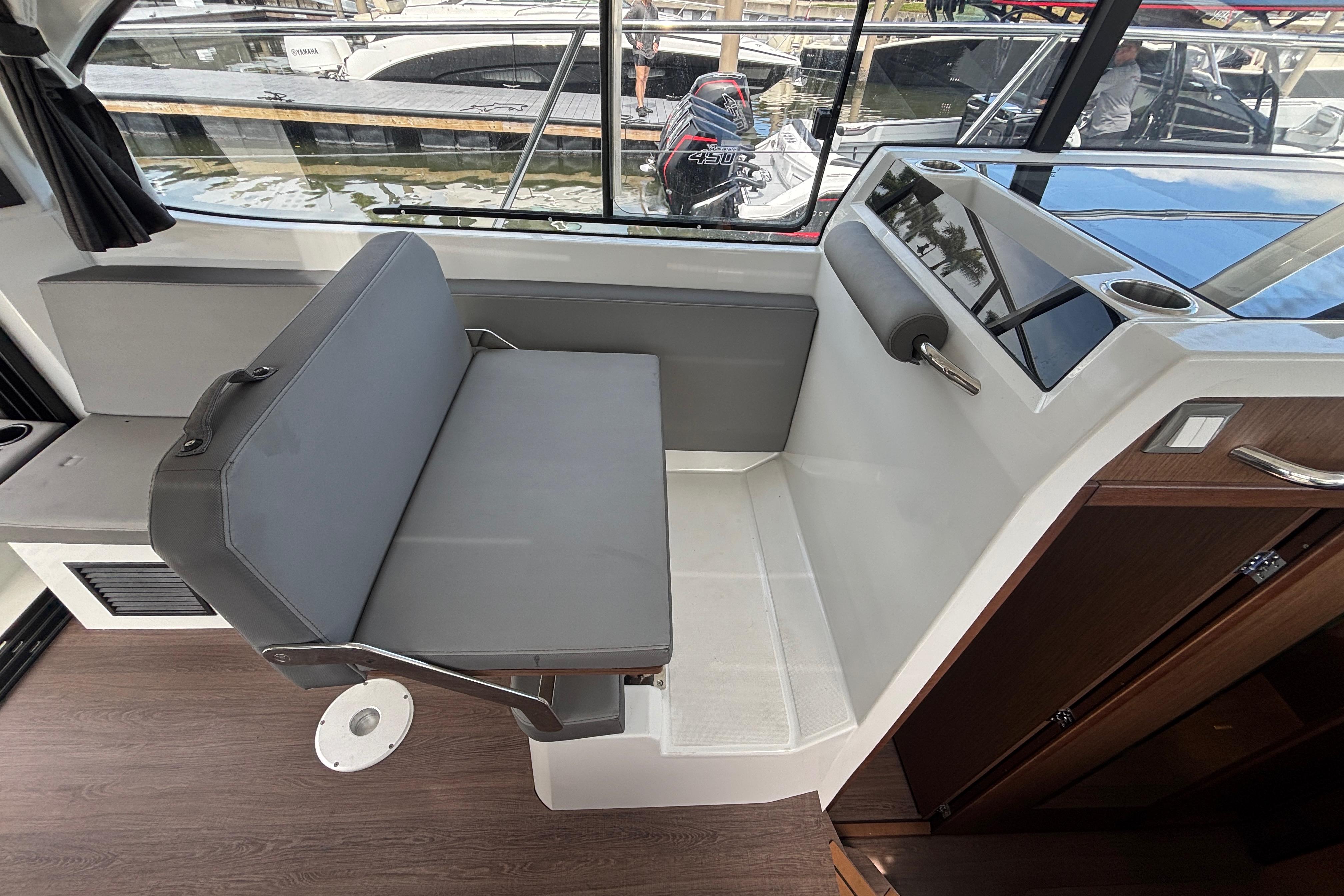Interior seating of 2024 Beneteau Antares 11 boat, featuring modern design and comfortable upholstery.