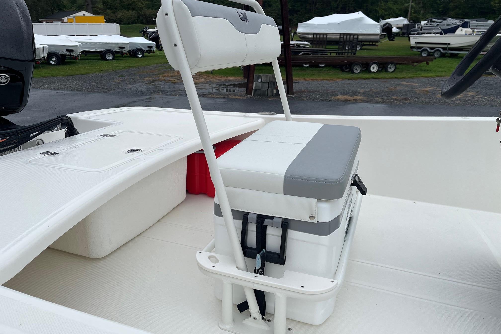2026 Mako Pro Skiff 17 CC boat interior with seating and storage.