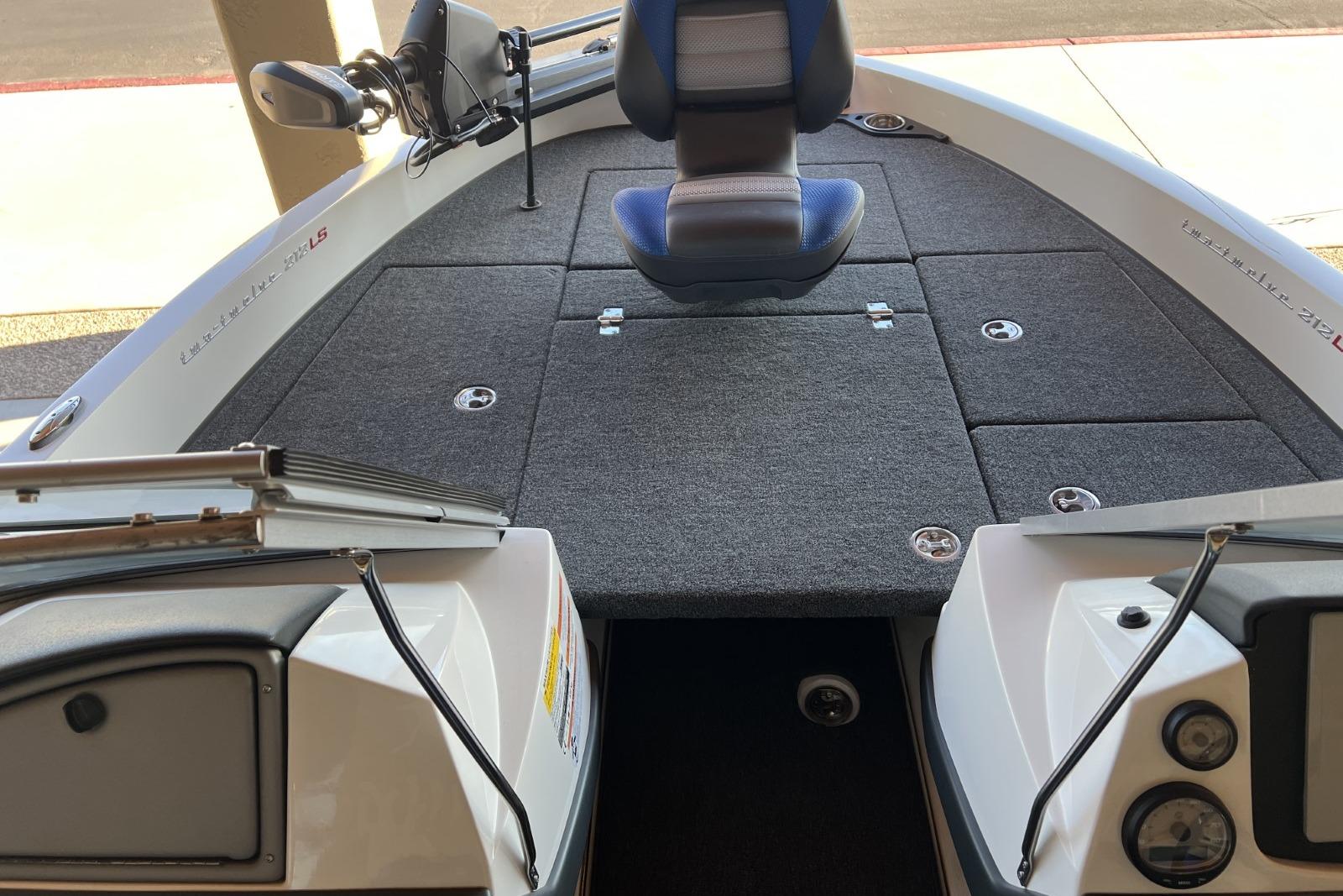 2025 Ranger 212LS boat interior with seating and carpeted deck.