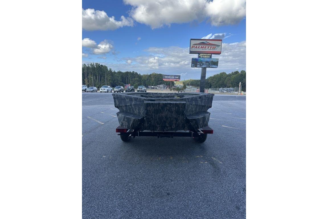 2025 Havoc 1860 boat on trailer in parking lot, cloudy sky background.