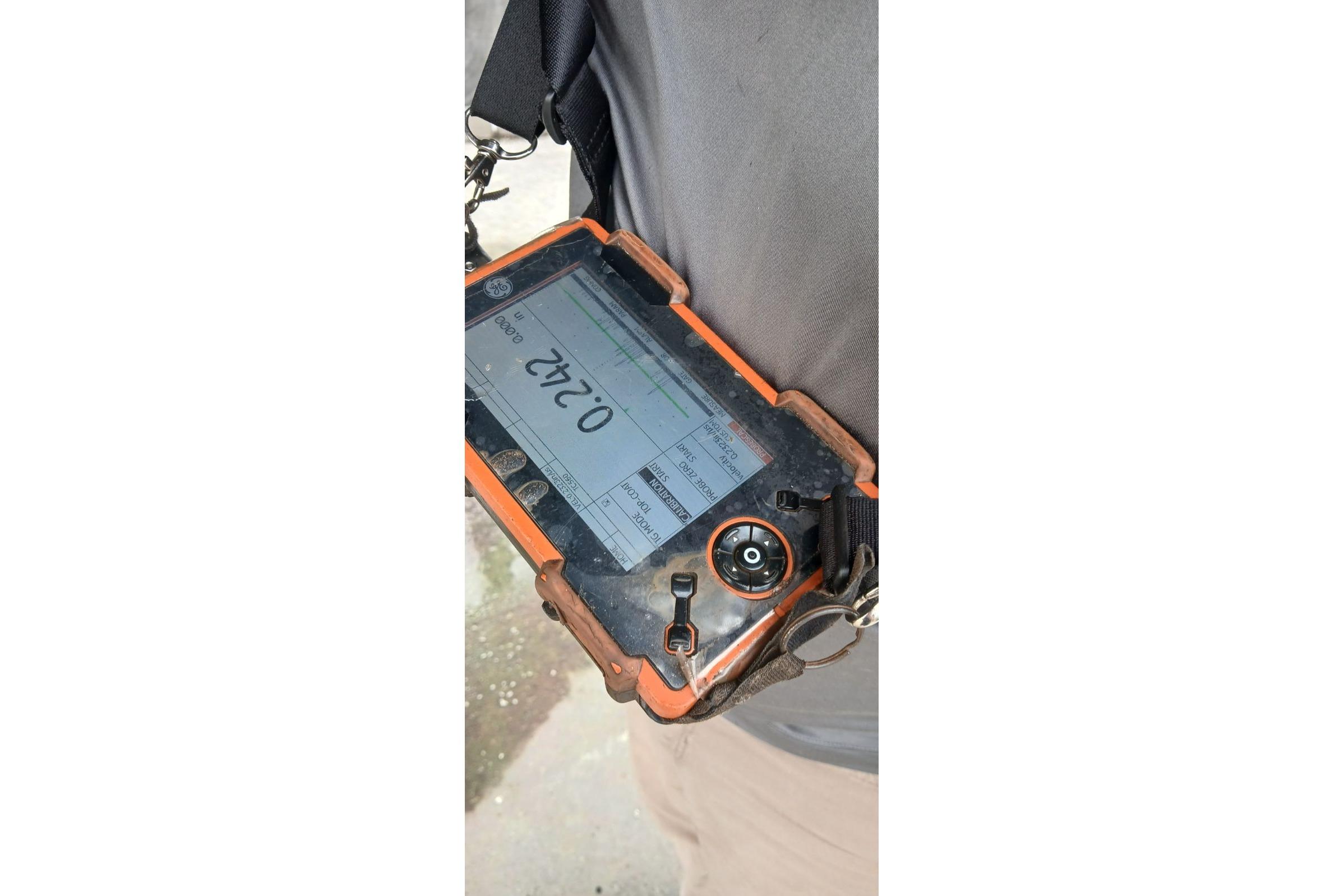Handheld device displaying measurement, related to Bruce Bingham Custom 47 Steel Hull, 1992 model.