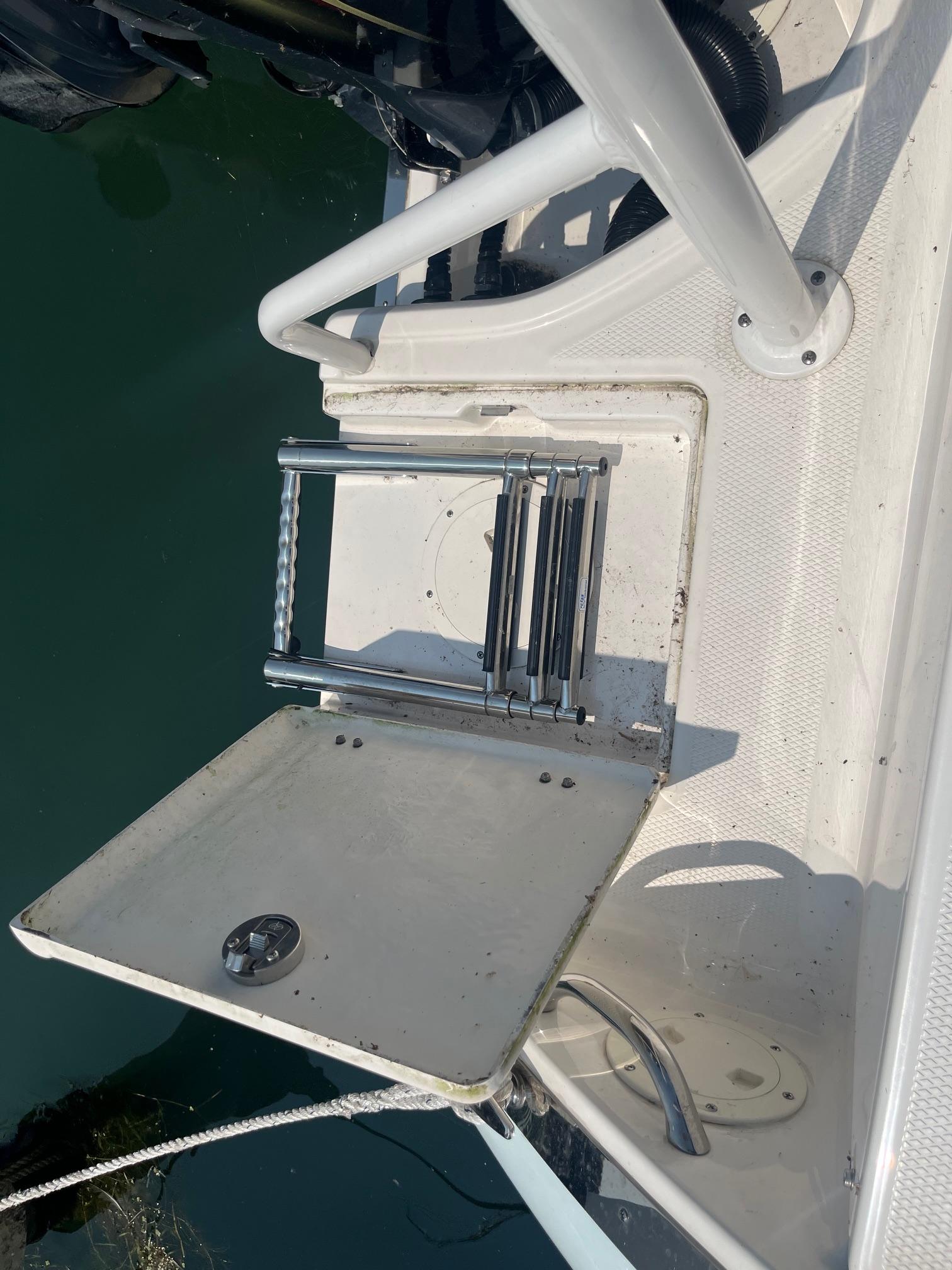 2020 Robalo R230 Center Console boat with foldable swim ladder.