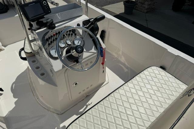 2023 Carolina Skiff 192 JLS boat interior with steering console and seating.