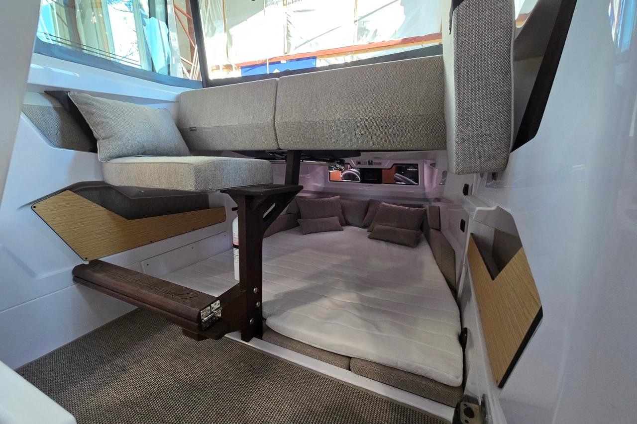 2026 Axopar 29 XC Cross Cabin interior with cozy seating and modern design.