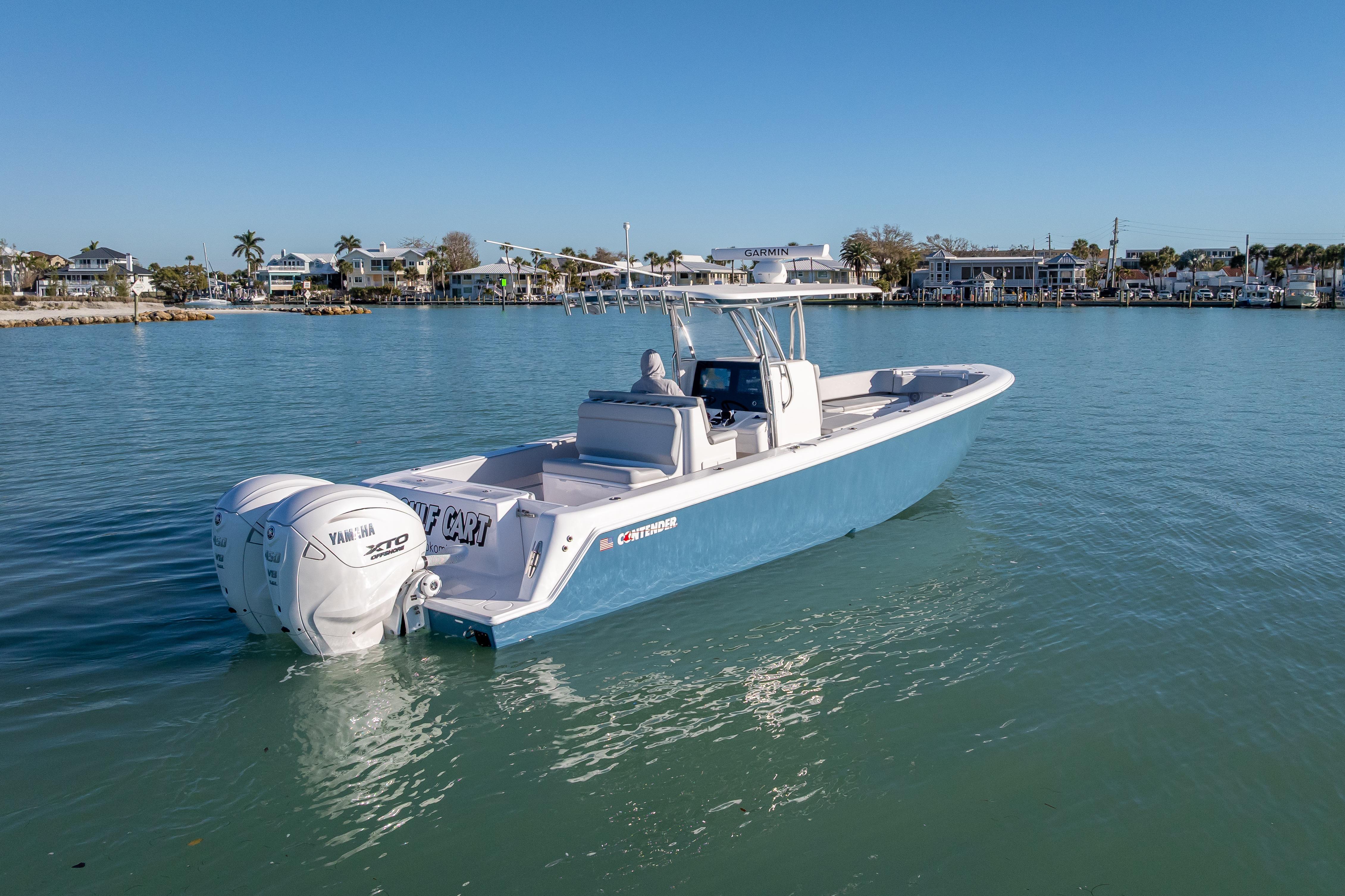 2026 Contender 35 ST boat with twin Yamaha engines on calm water.