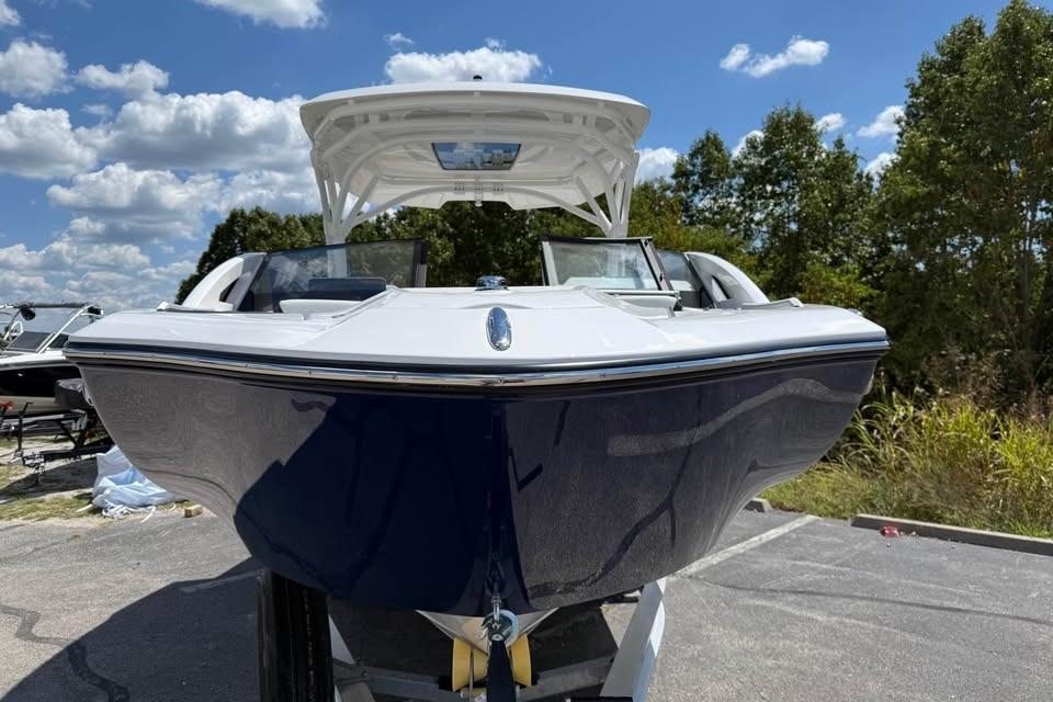 2026 Yamaha Boats 275SD, sleek design, parked outdoors under a blue sky.
