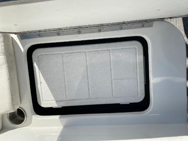 2019 Caravelle 19 EBo Bowrider storage compartment with a closed hatch.