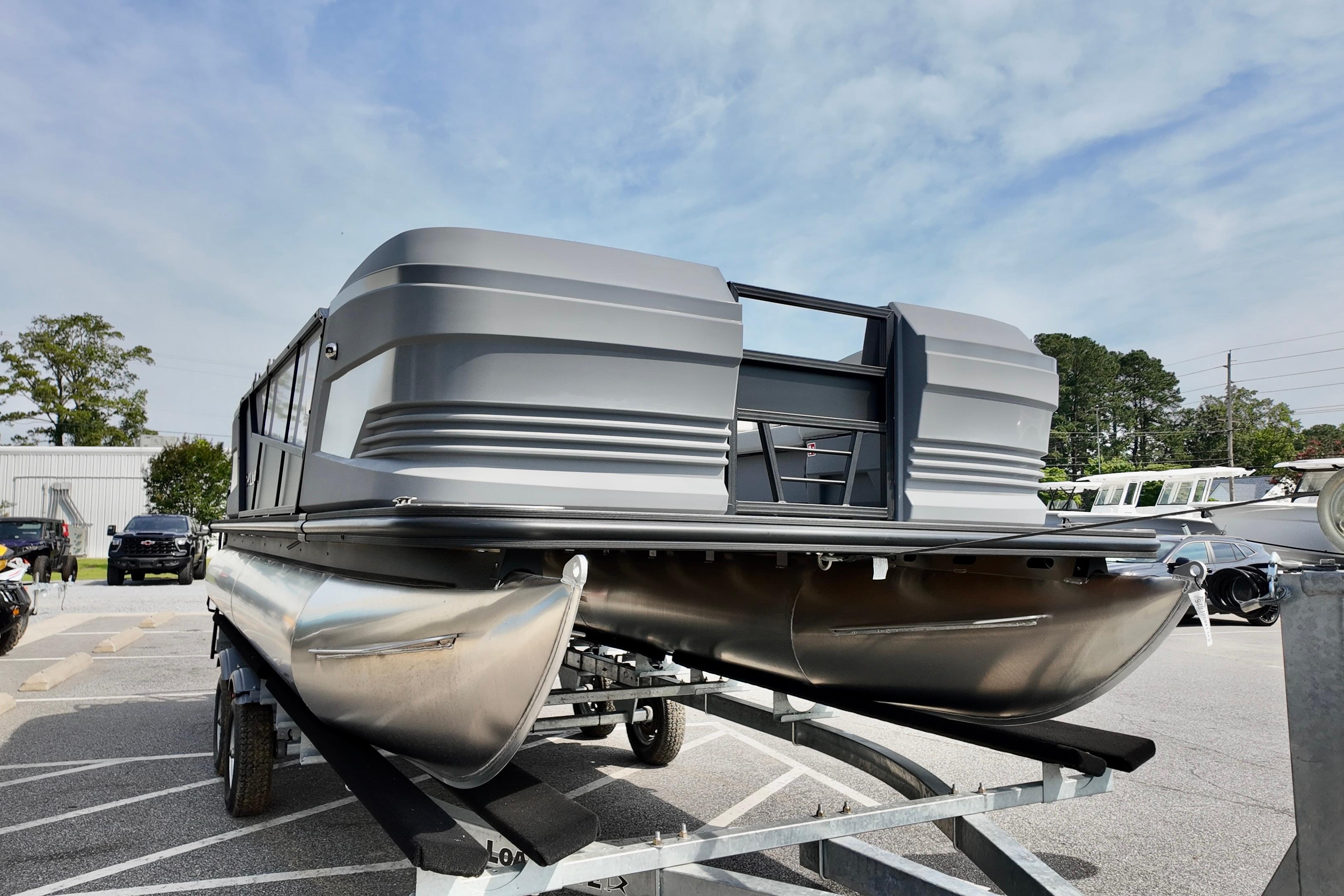 2026 Sylvan A-20 LZ DH pontoon boat on trailer, parked outdoors.