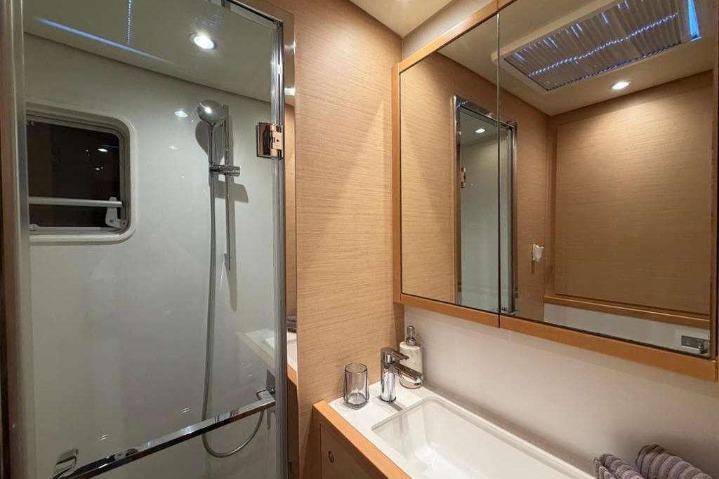 Luxurious bathroom in 2019 Lagoon 630 MY yacht with modern fixtures and elegant design.