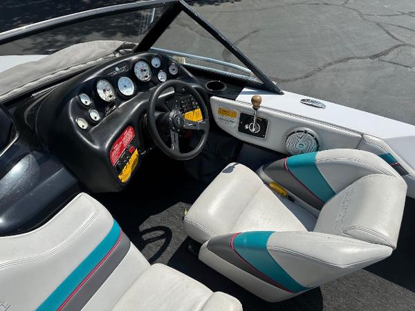 1992 Correct Craft Ski Nautique boat interior with steering wheel and dashboard controls.