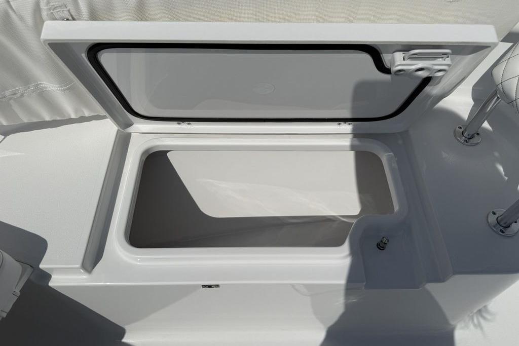 Open storage compartment on 2026 Sportsman Open 252 Center Console boat.
