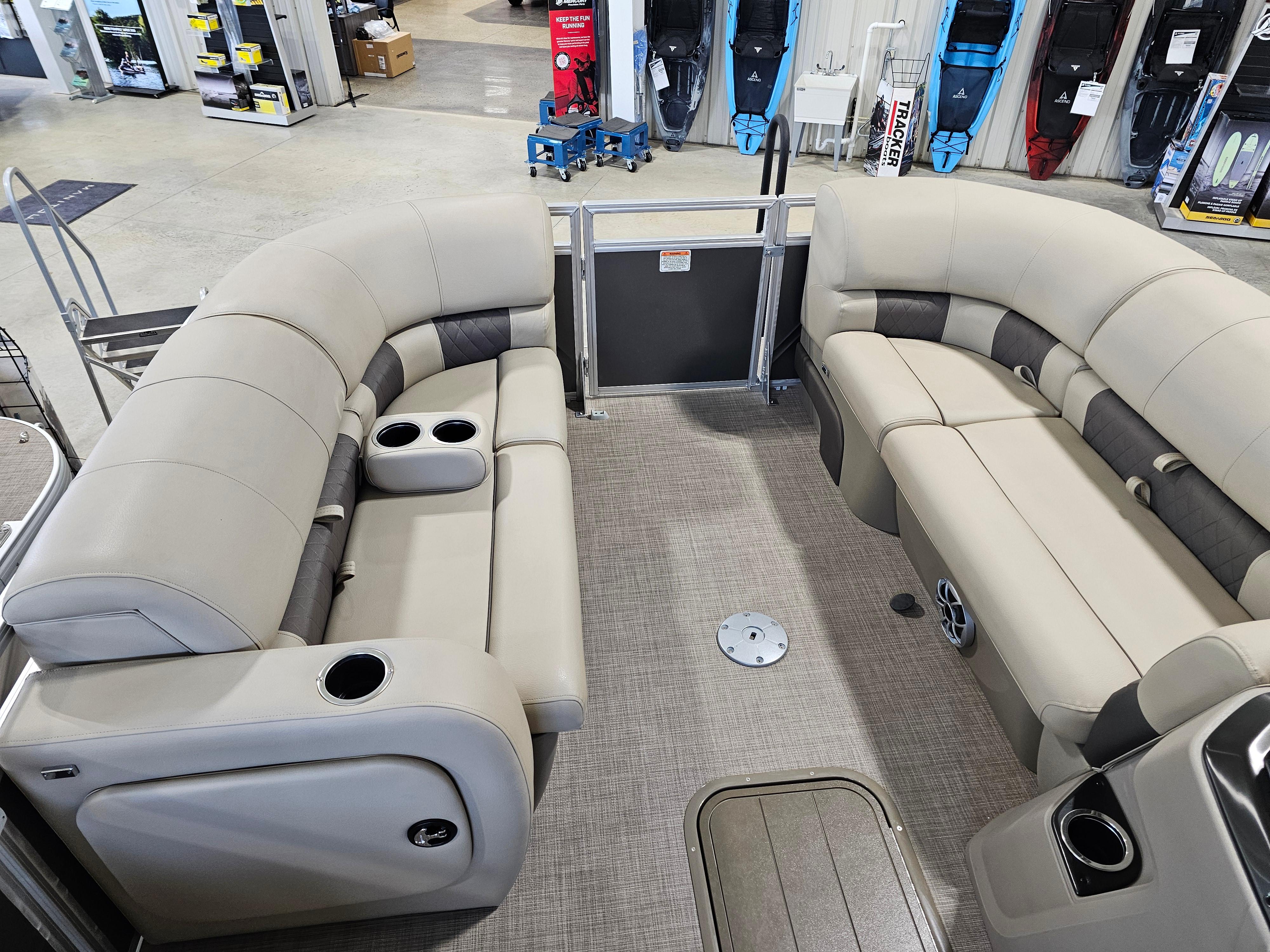 2024 Sun Tracker Party Barge 22 RF XP3 interior with plush seating and cup holders.