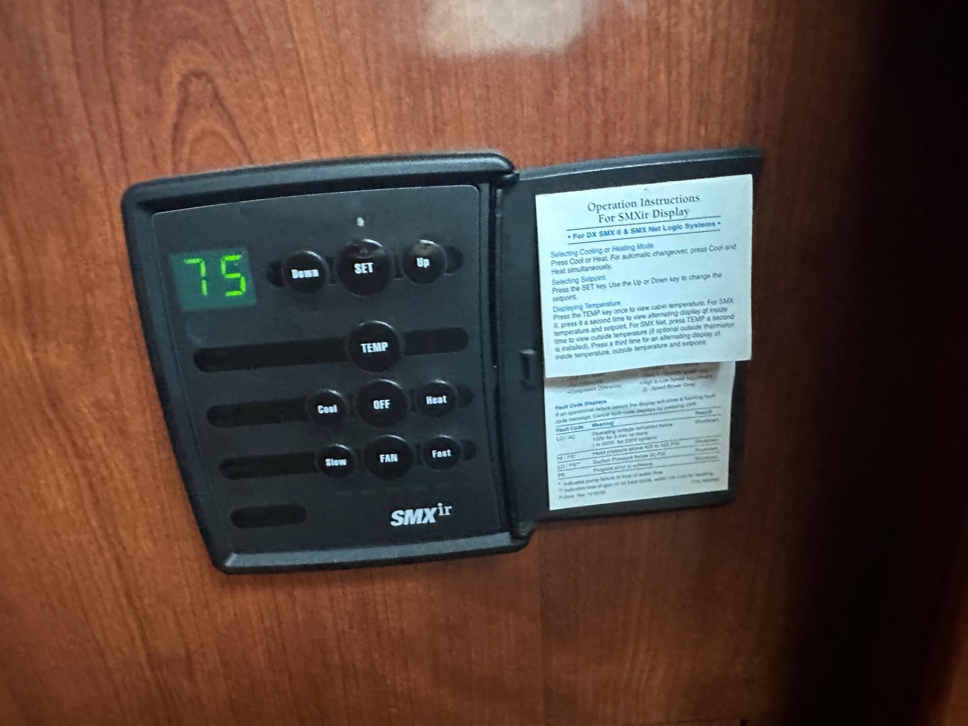Thermostat control panel on 2004 Sea Ray 390 Motor Yacht, displaying temperature at 75 degrees.