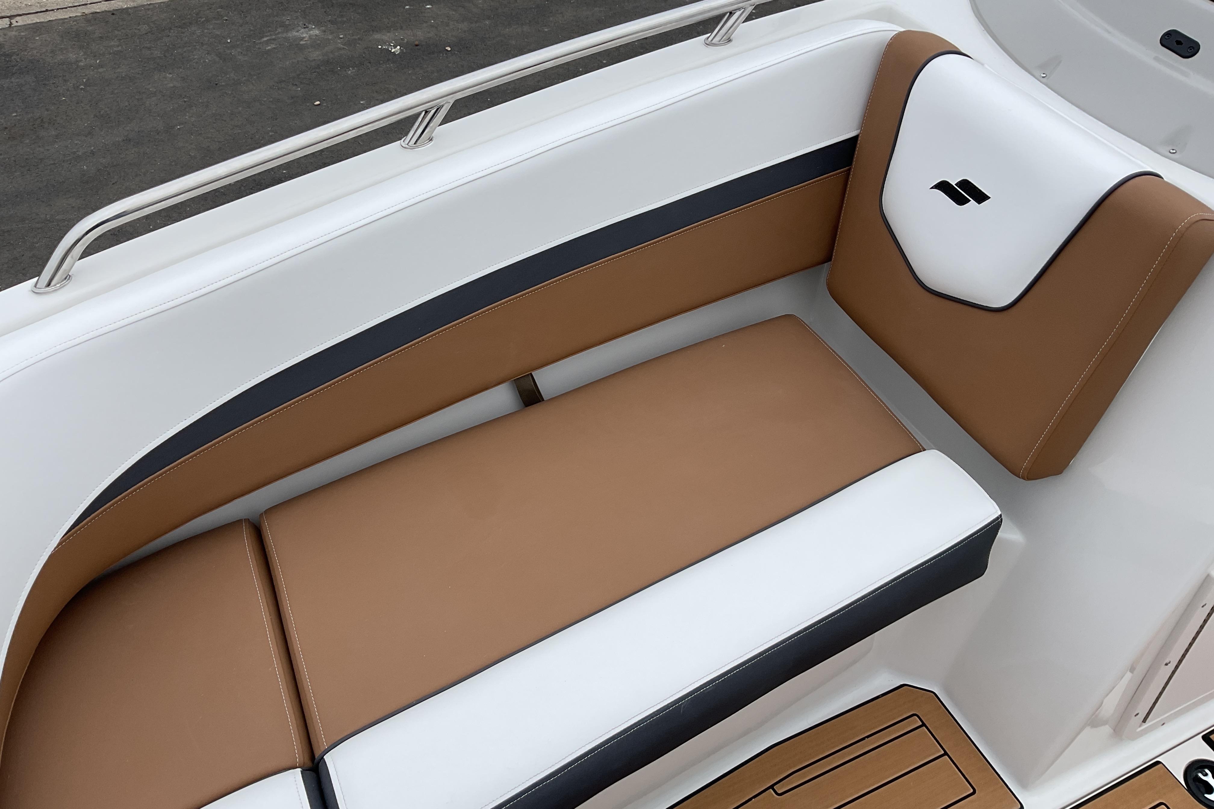2026 Starcraft SVX 211 OB boat seating with brown and white upholstery.