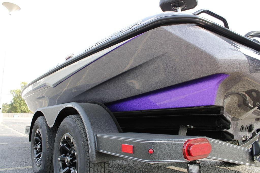 2026 Skeeter ZXE21 boat on trailer, featuring sleek design and vibrant purple accents.