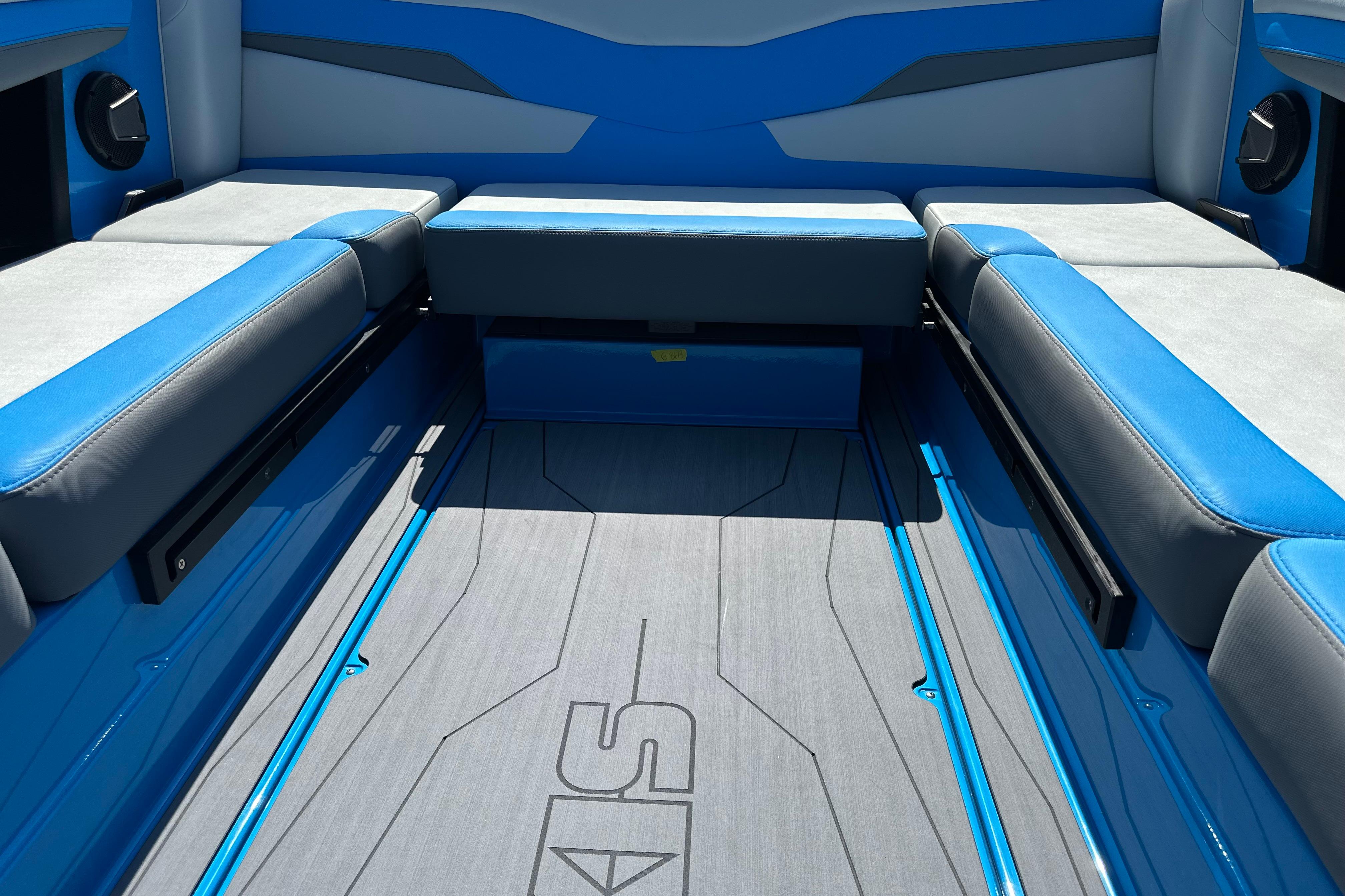 2026 Axis T235 boat interior with blue and gray seating and sleek flooring design.