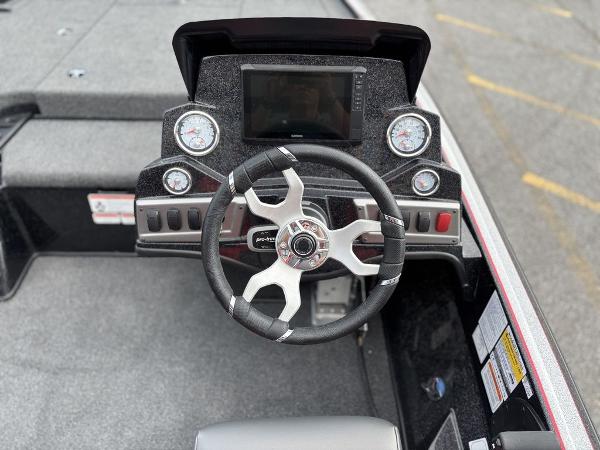 Steering console of a 2025 Nitro Z19 Pro boat with modern gauges and controls.