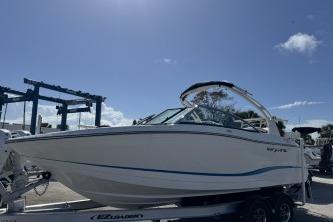 2019 Bryant Calandra 23 boat on trailer under clear blue sky.