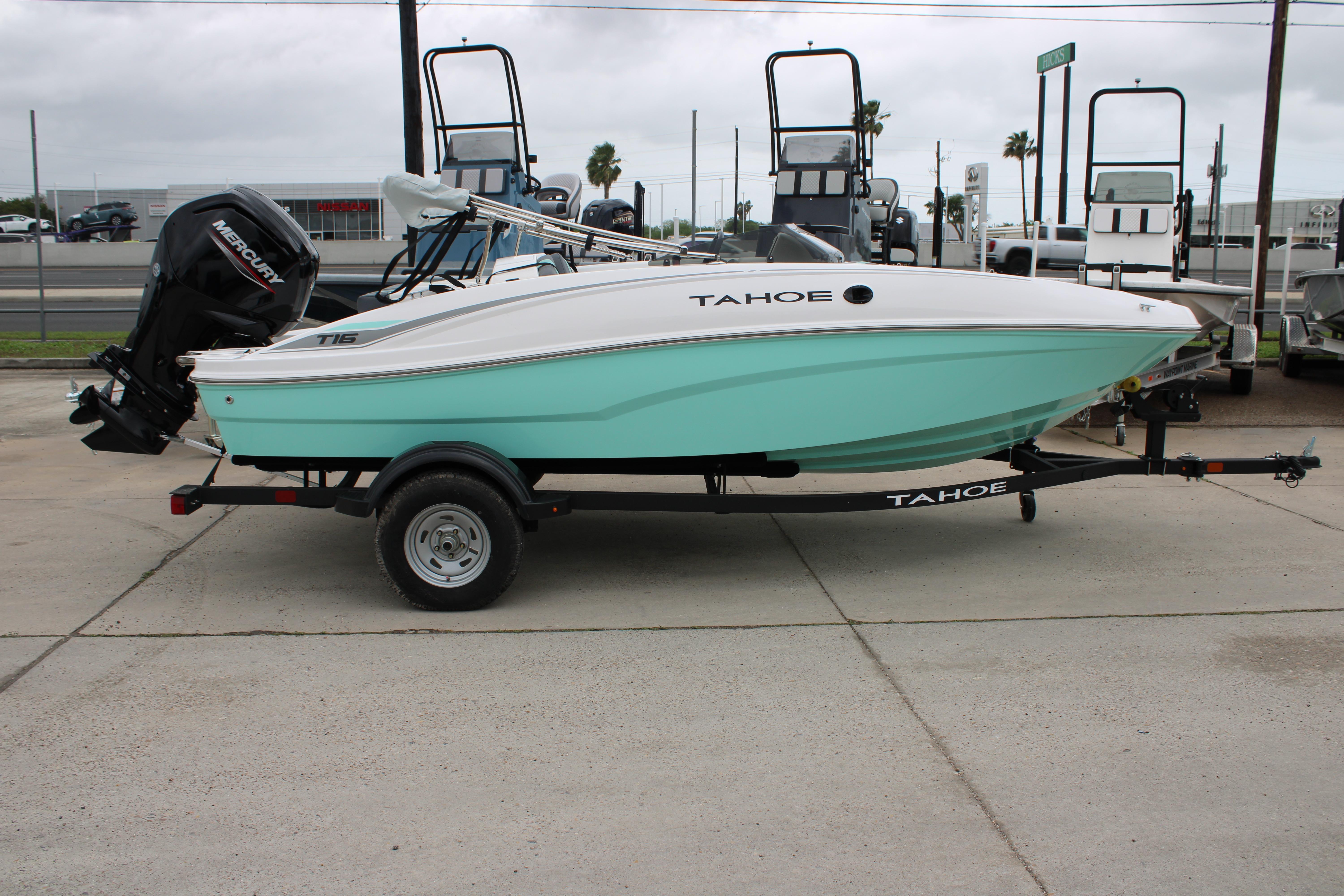 2026 Tahoe T16 boat with Mercury engine on trailer, displayed outdoors.