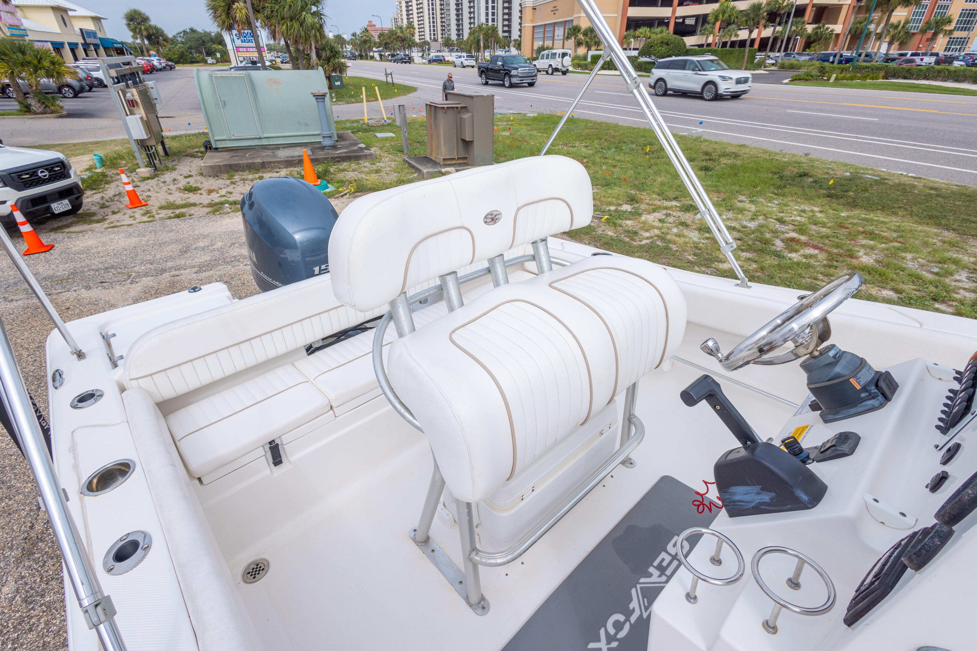 2014 Sea Fox 209 Commander boat interior with white seating and steering console.