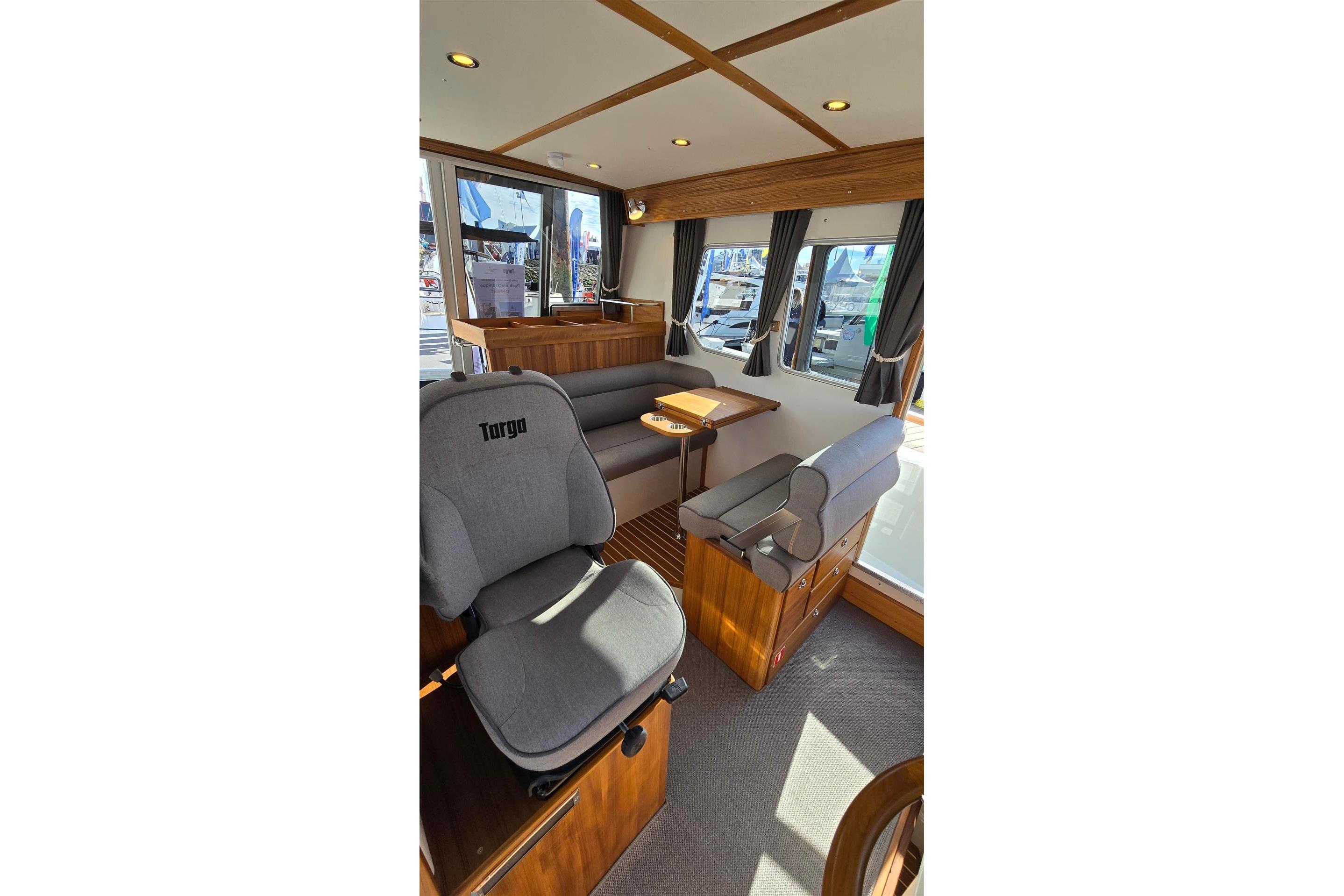 Interior of 2026 Targa 27.2 boat with seating and wooden accents.