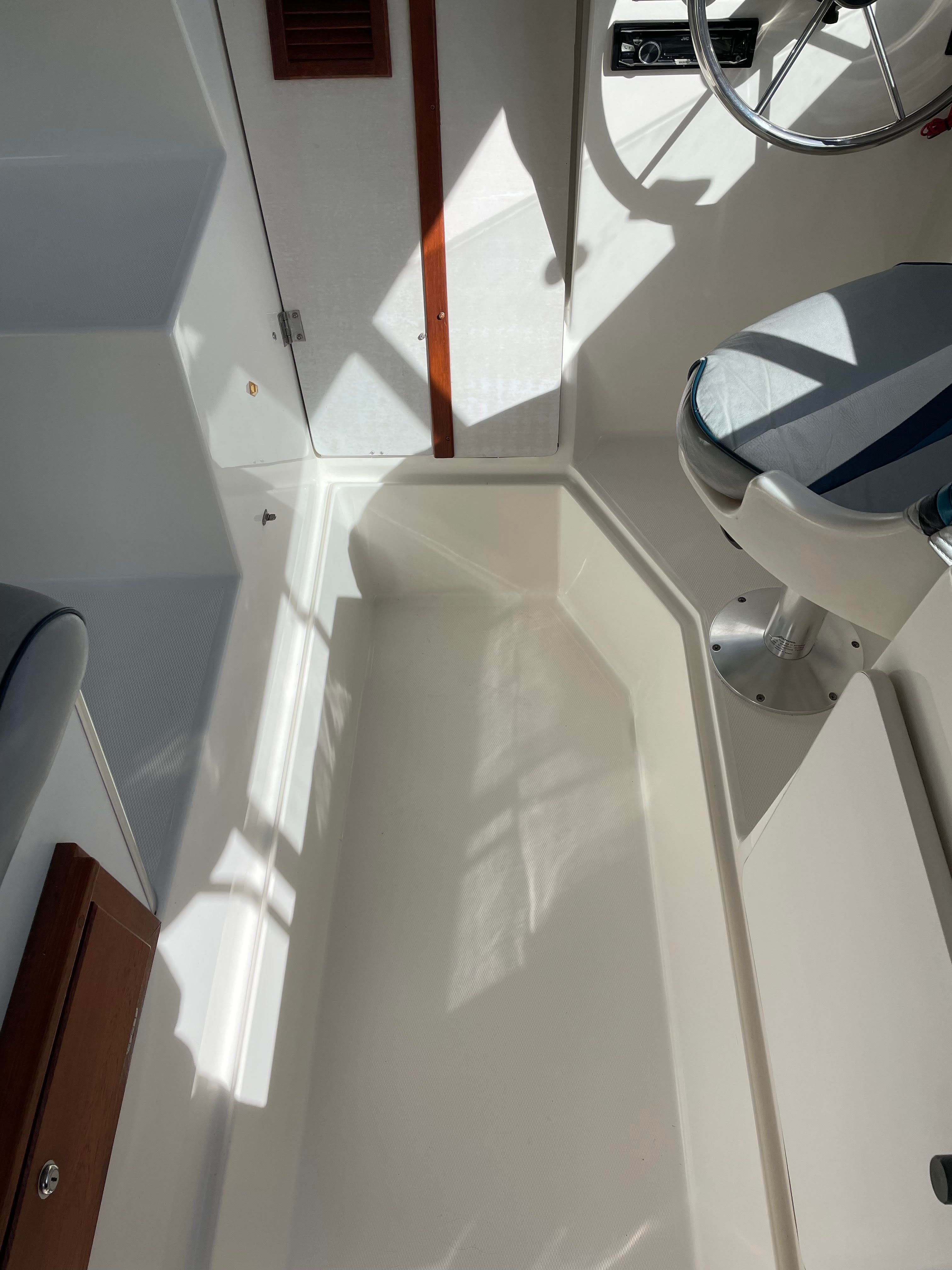 Interior of a 1991 Bayliner 2159 with seating and steering wheel.