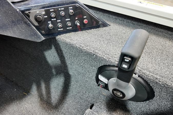 2024 Lowe Stinger 188 boat control panel and throttle lever, featuring multiple switches.