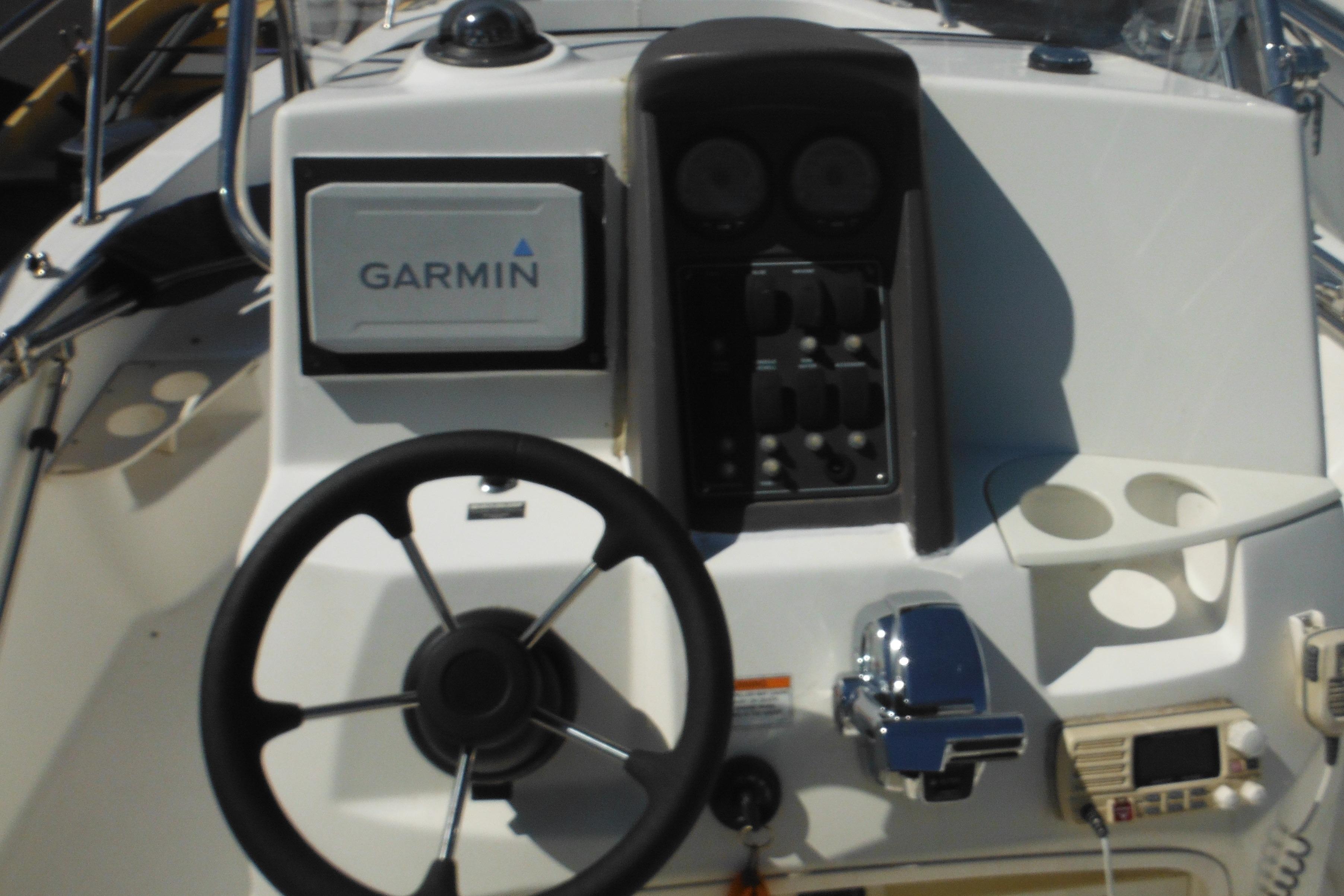 2009 Boston Whaler 200 Dauntless boat dashboard with Garmin navigation system.