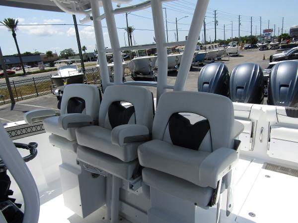 2024 Wellcraft 352 Fisherman boat with triple seating and outboard engines.
