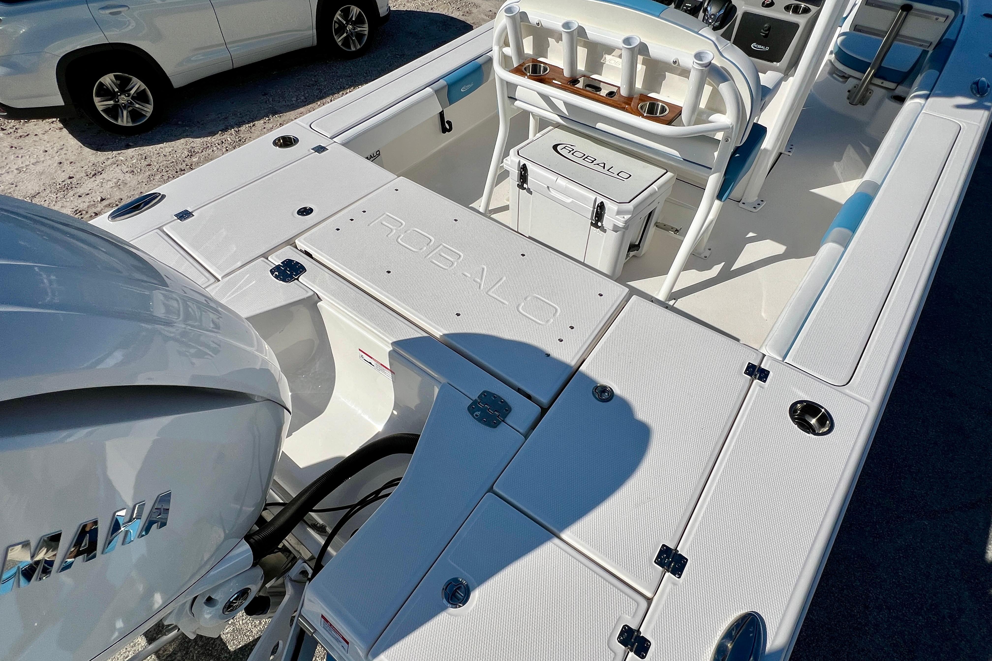 2026 Robalo 246 Cayman boat interior with Yamaha engine, featuring spacious deck and storage.