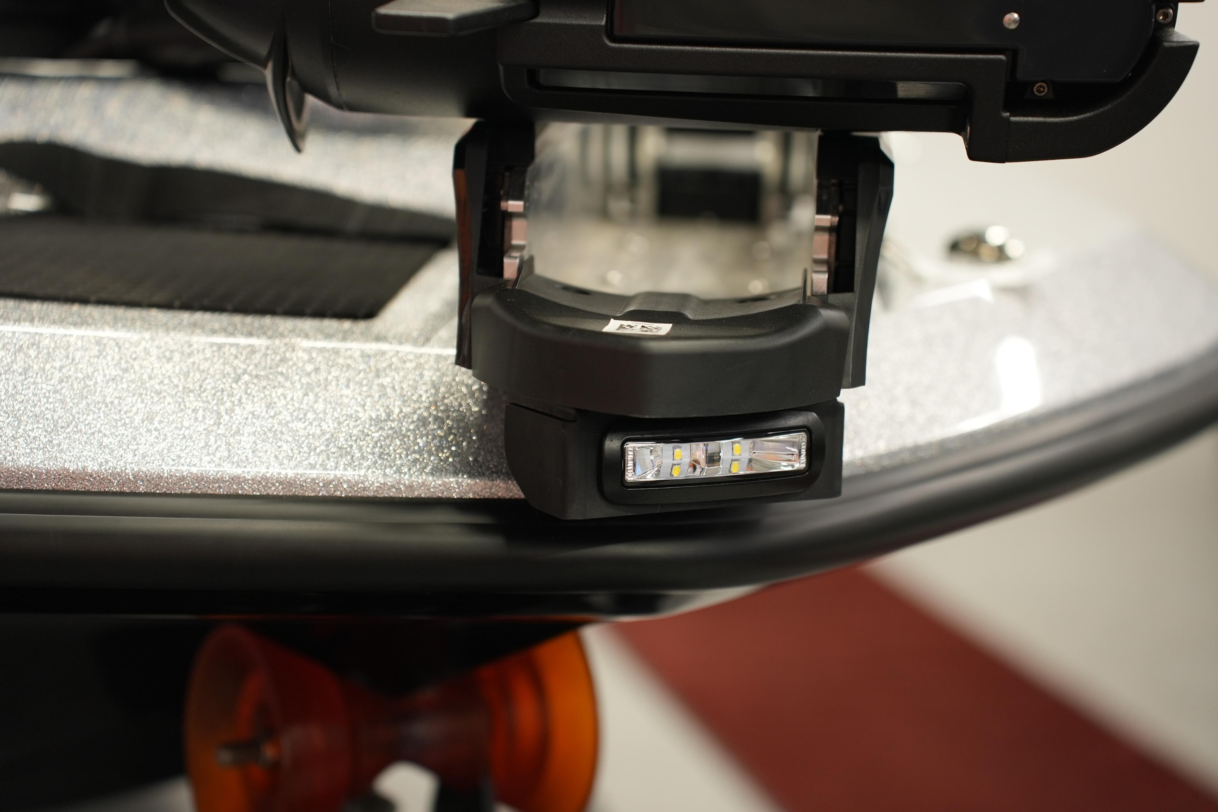 Close-up of iKon LXE20 2026 boat detail with LED light on metallic surface.