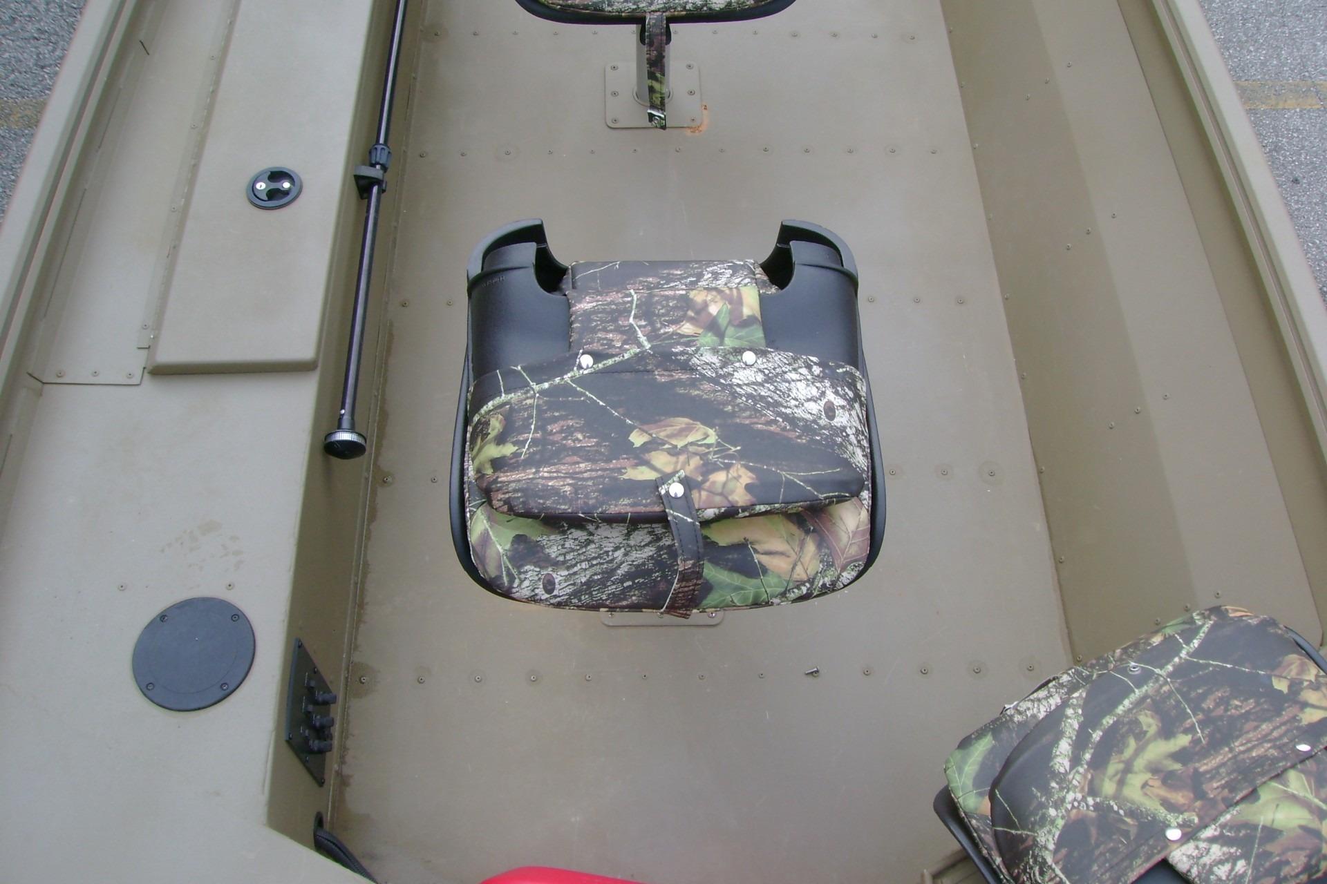 2023 G3 1652 DK boat interior with camouflage seating and storage compartments.