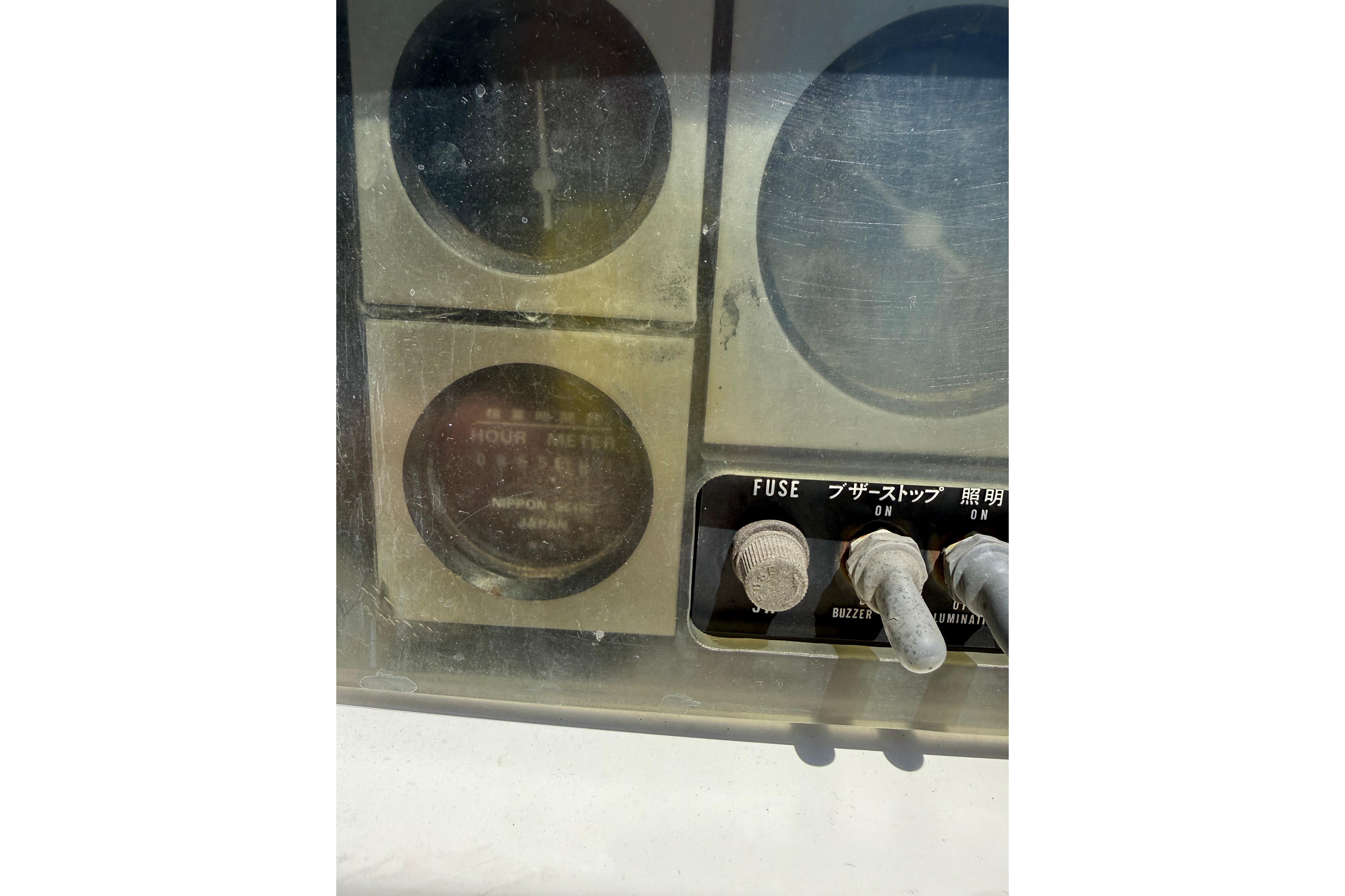 Control panel of a 2004 Sabre 386 with hour meter and fuse switches.