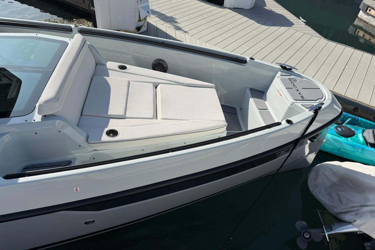 2024 Saxdor 320 GTC boat docked, featuring sleek design and comfortable seating.