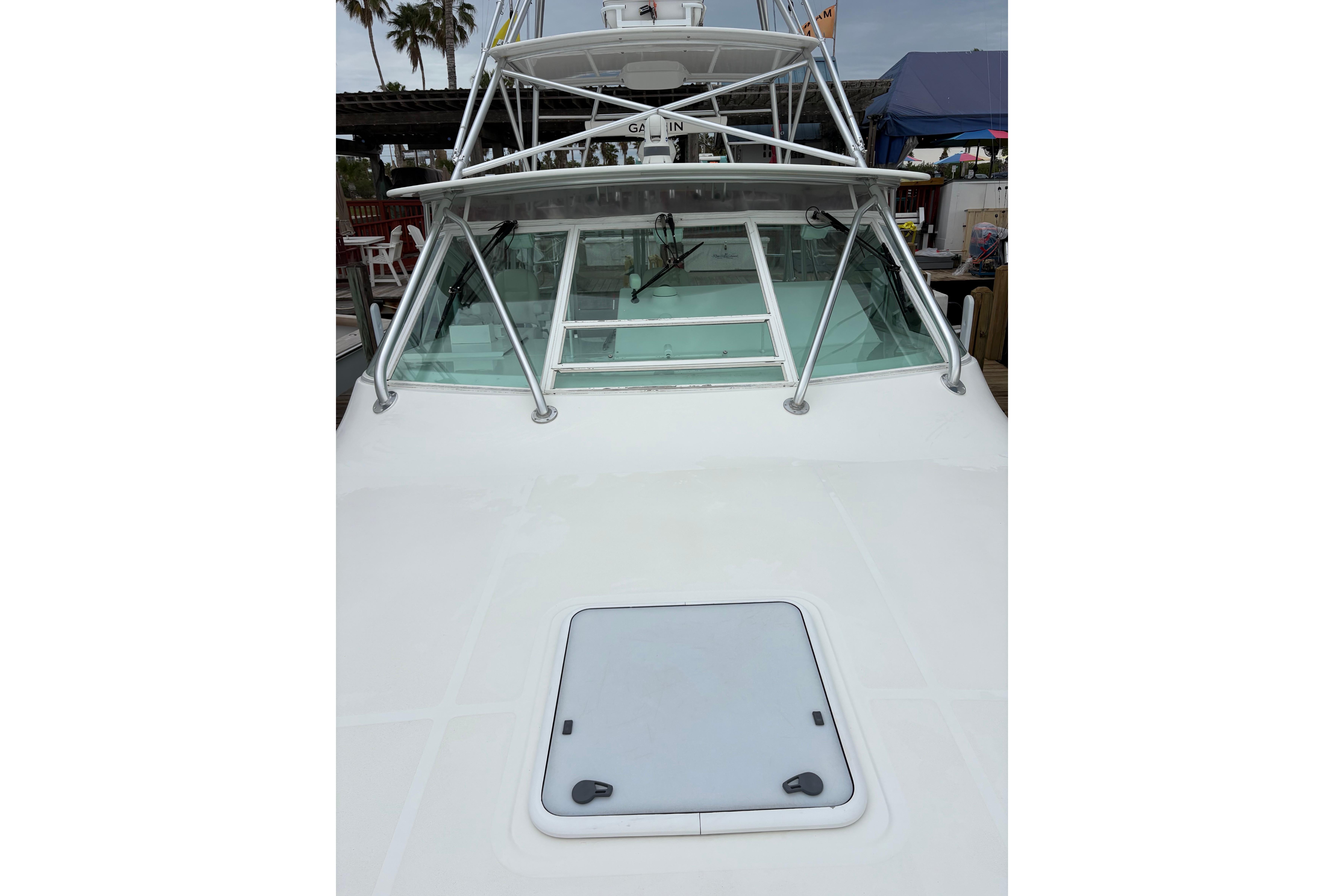 2004 Cabo 40 Hardtop Express boat with sleek design and sturdy windshield.