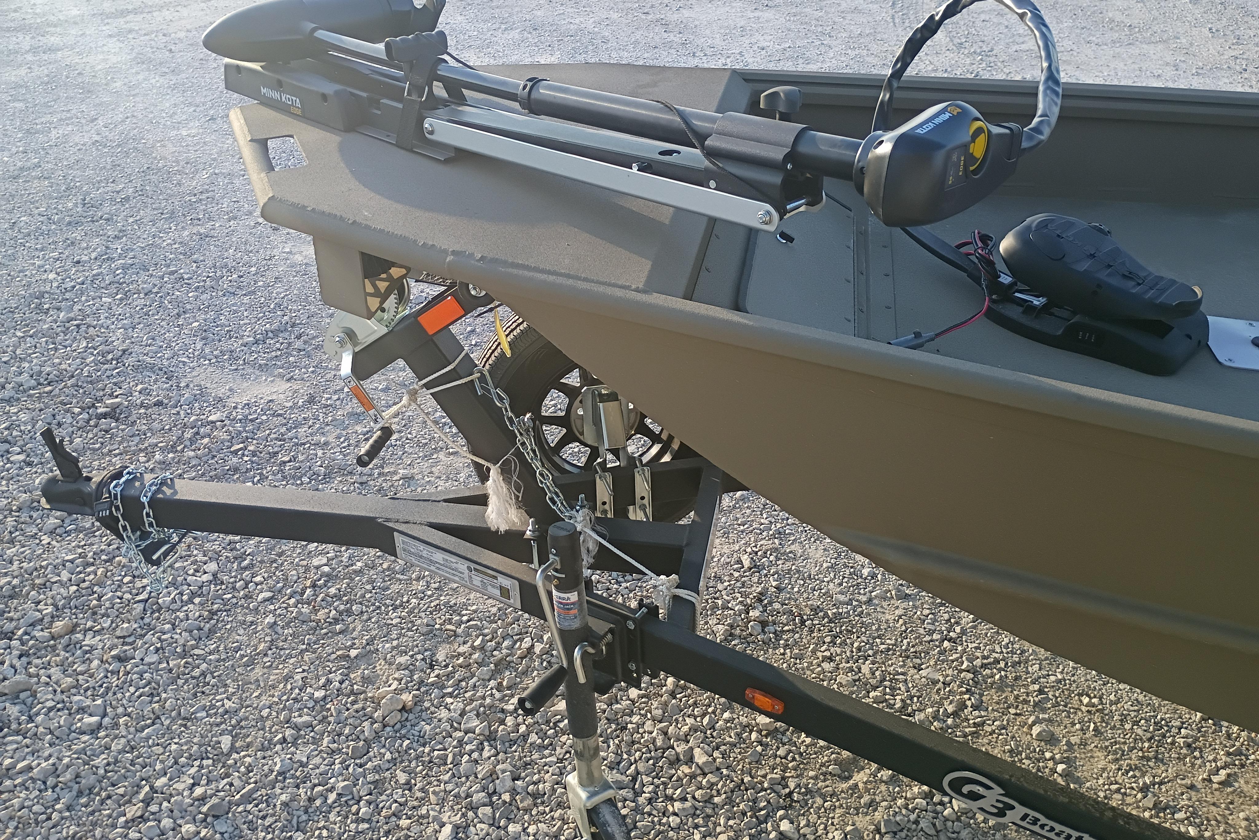 2026 G3 Gator Tough 16 FL boat on trailer with motor and chains.