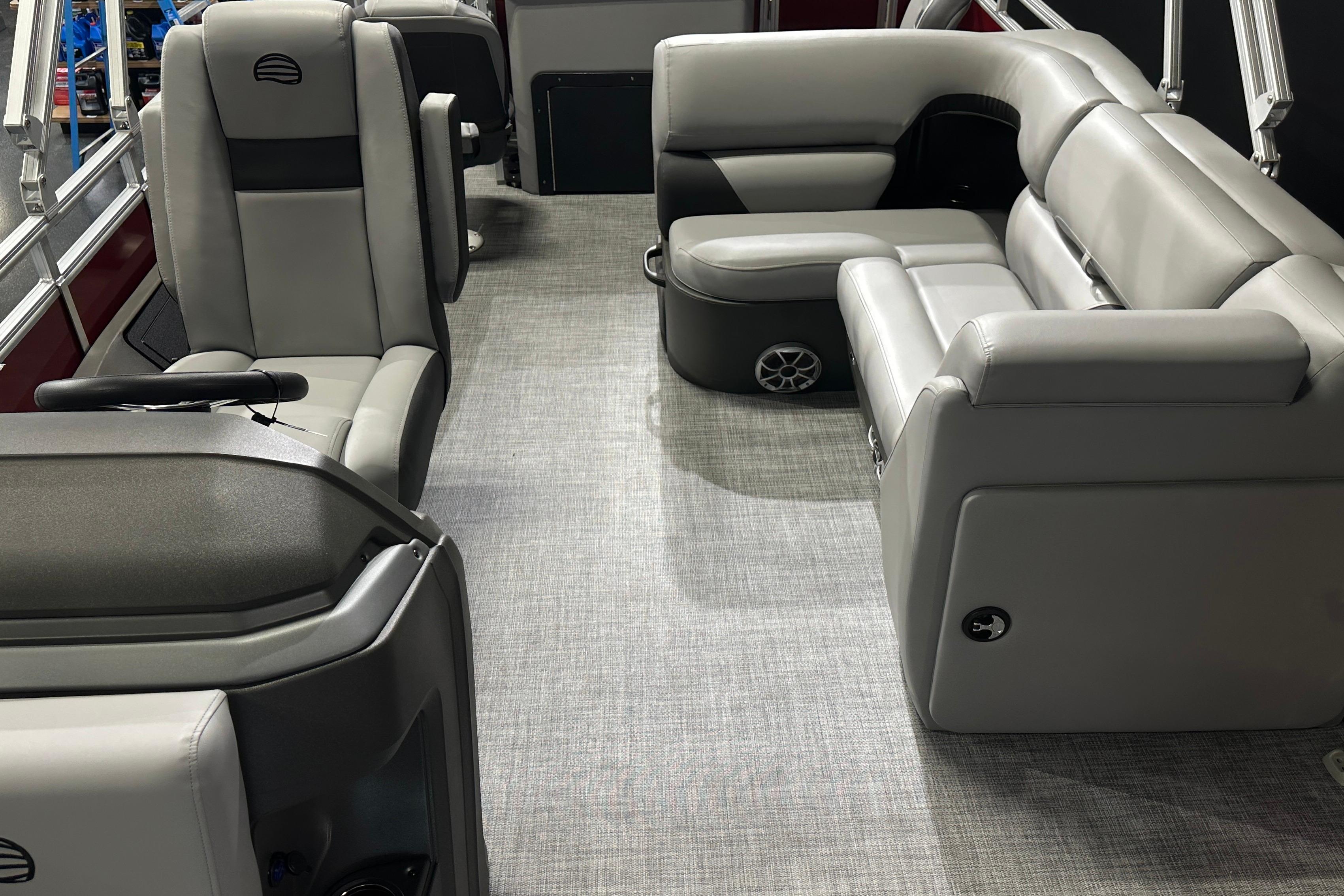 2026 Sun Tracker SportFish 22 DLX interior with gray seating and modern design.